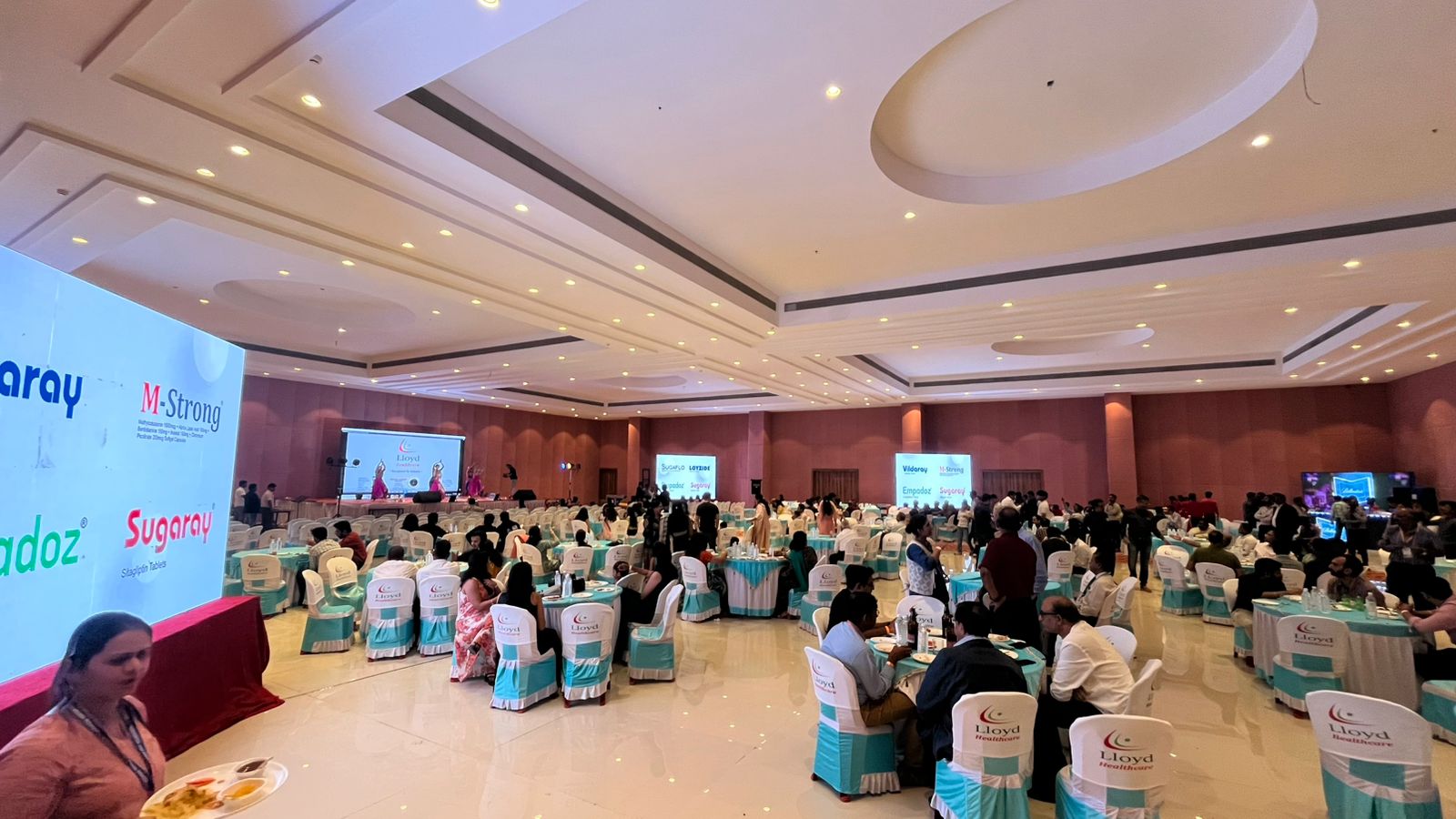 a room with rows of blue chairs