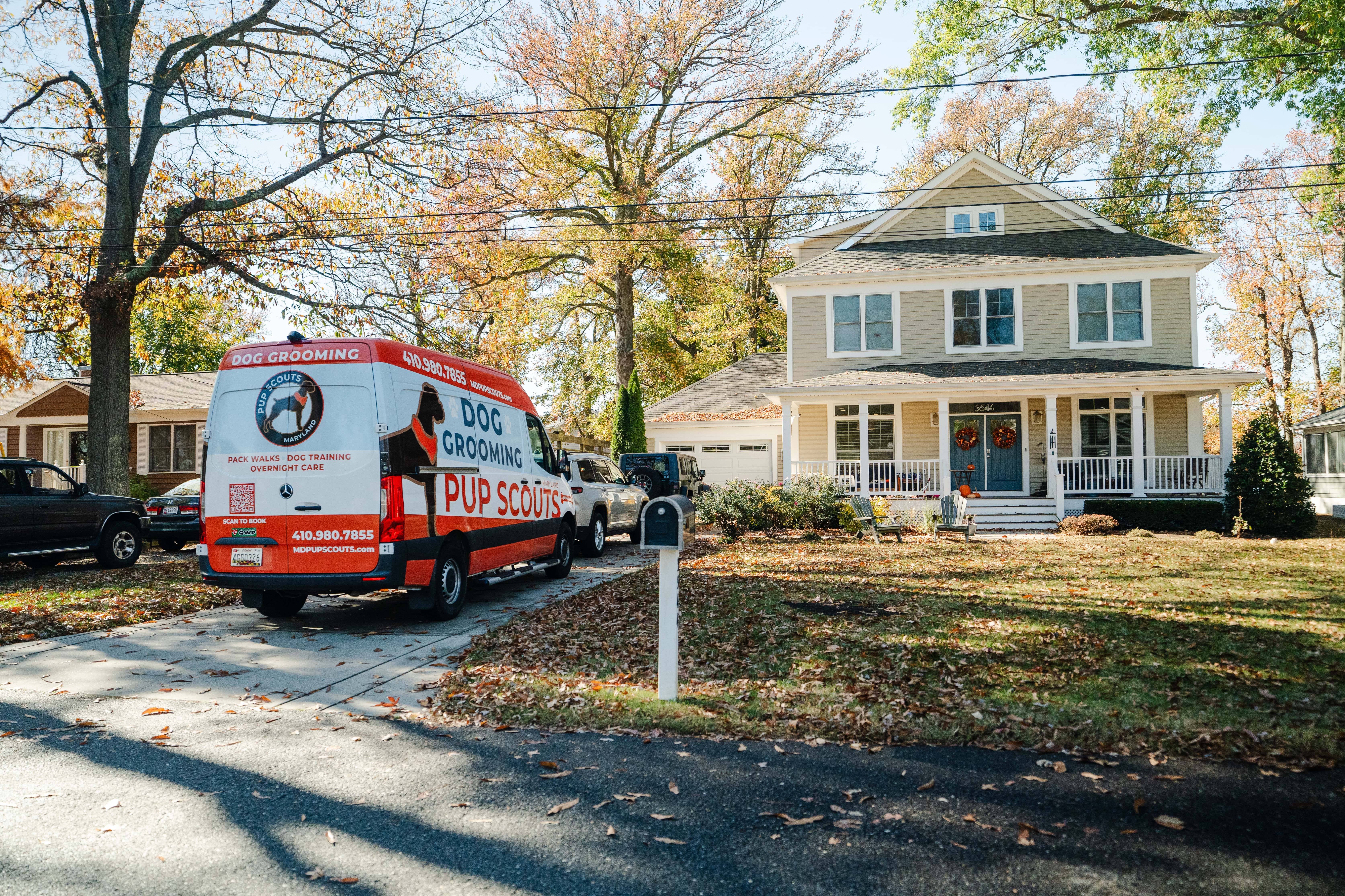 Pup Scouts mobile dog grooming van parked in residential driveway in Maryland