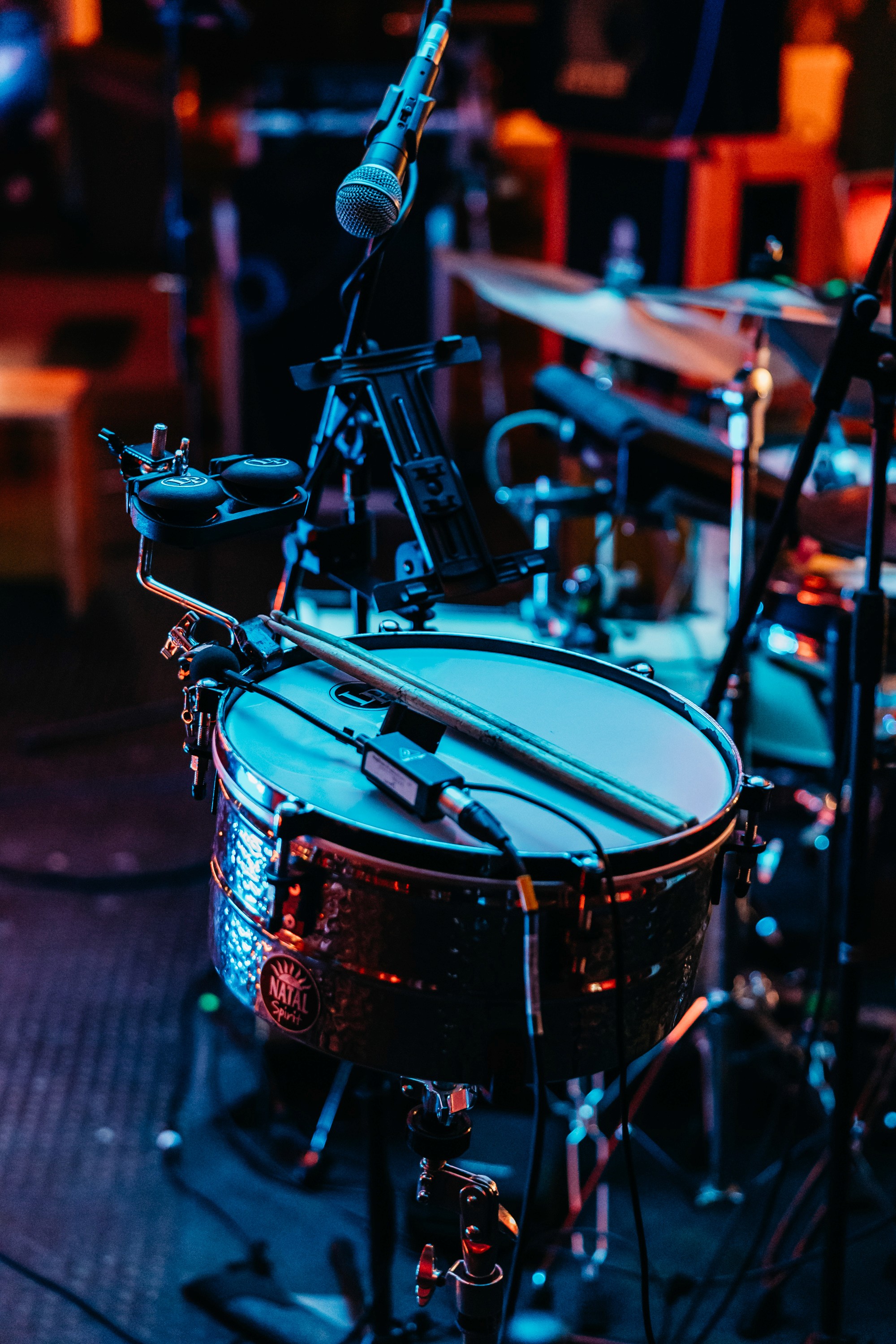 a group of people in a room with red lights
