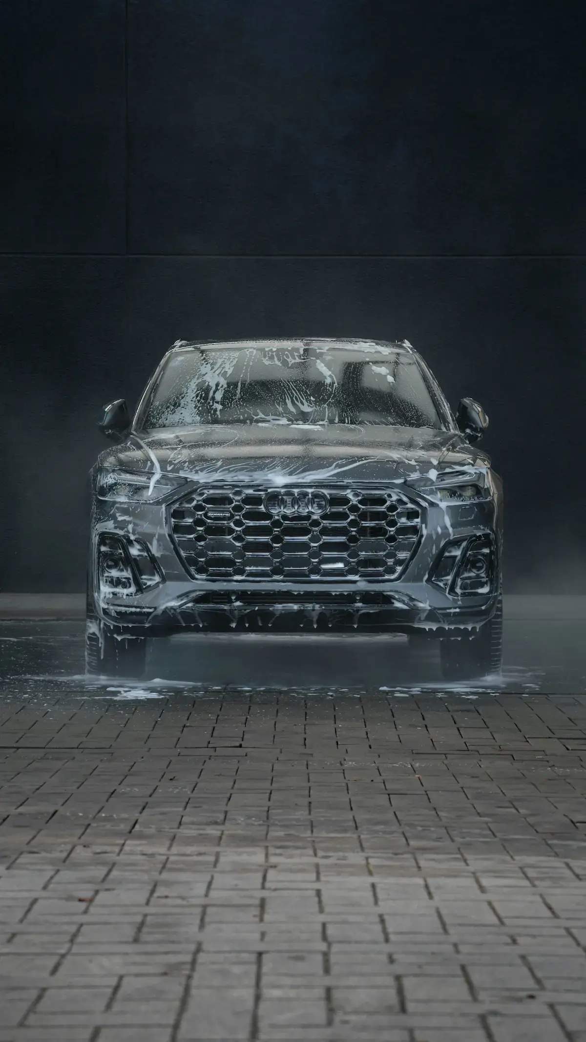 image of a car with soap suds falling off