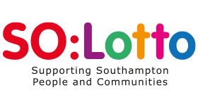 A man standing with Sufboard