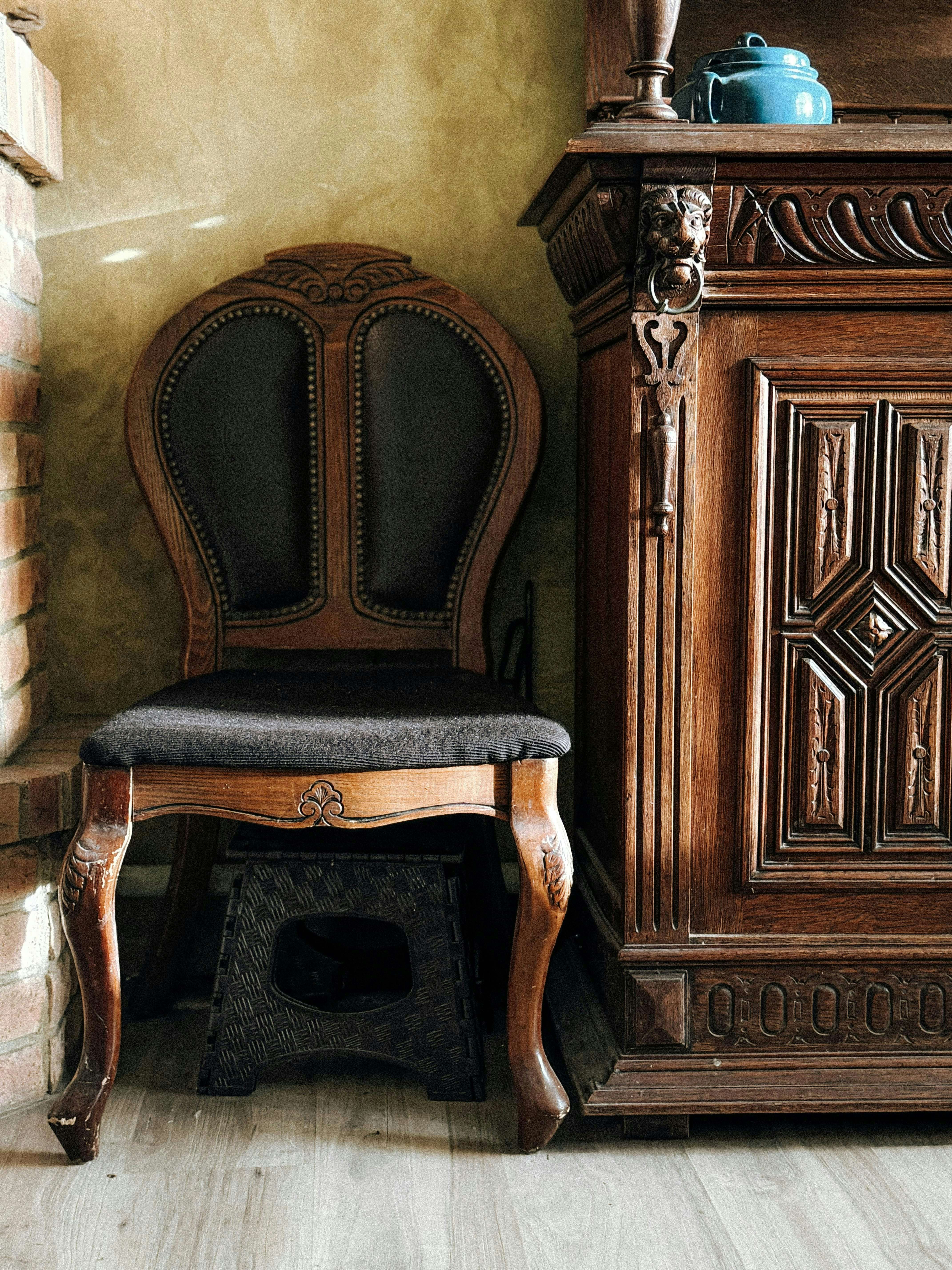 A chair and cabinent in a room