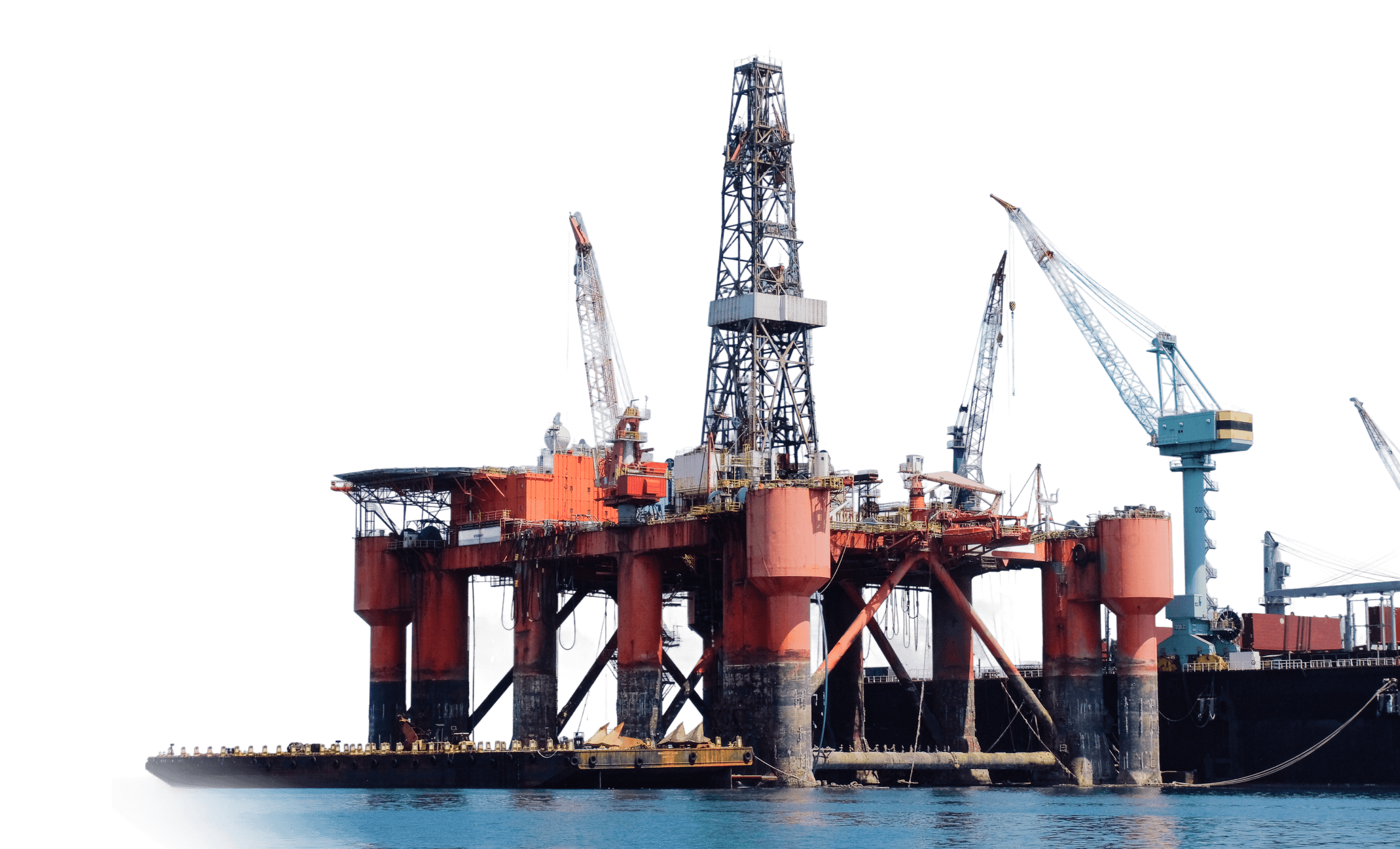 An offshore oil rig stands prominently against a blue background, showcasing industrial structures and equipment.
