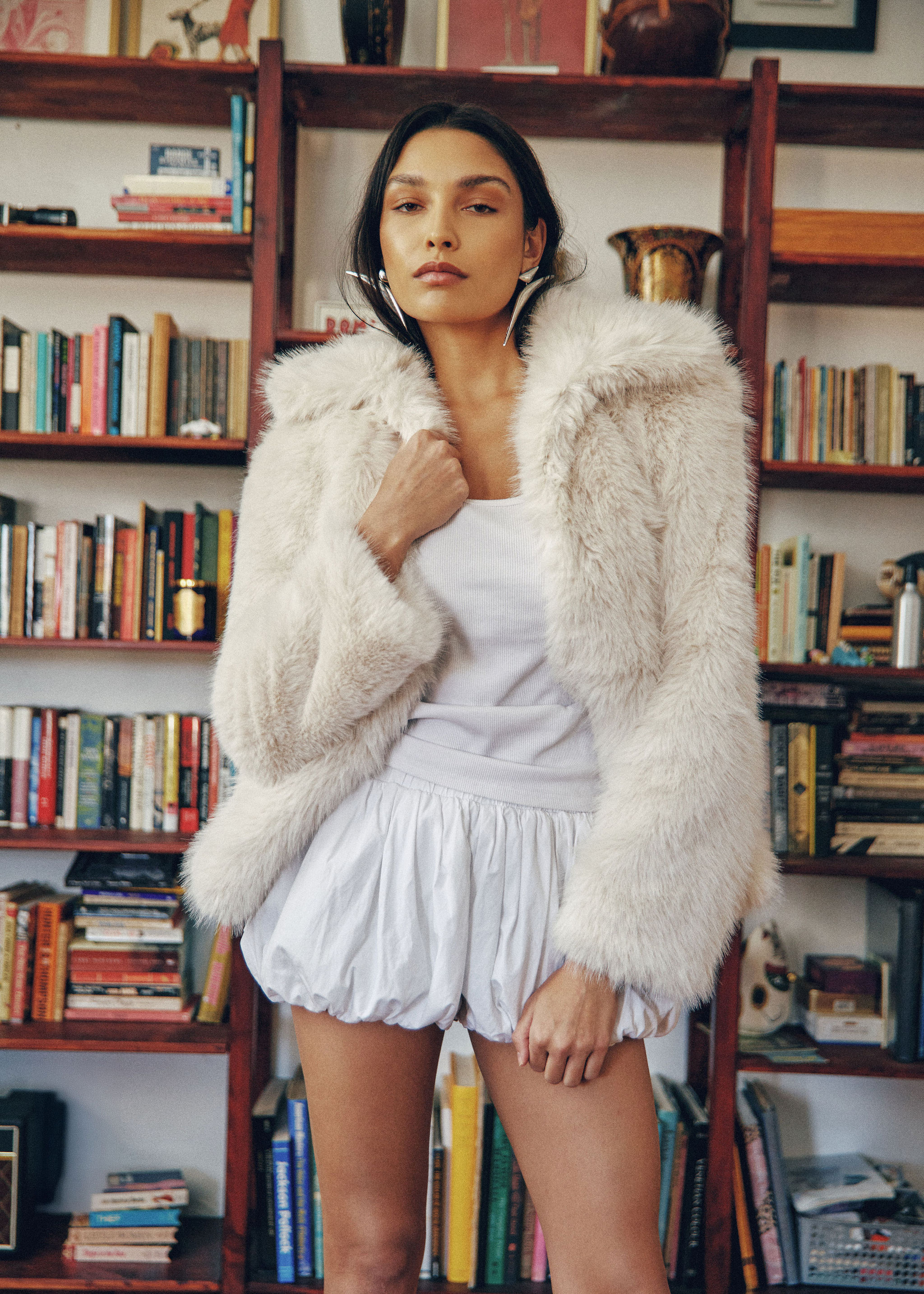 Woman walking on a curved pavement with shadow.