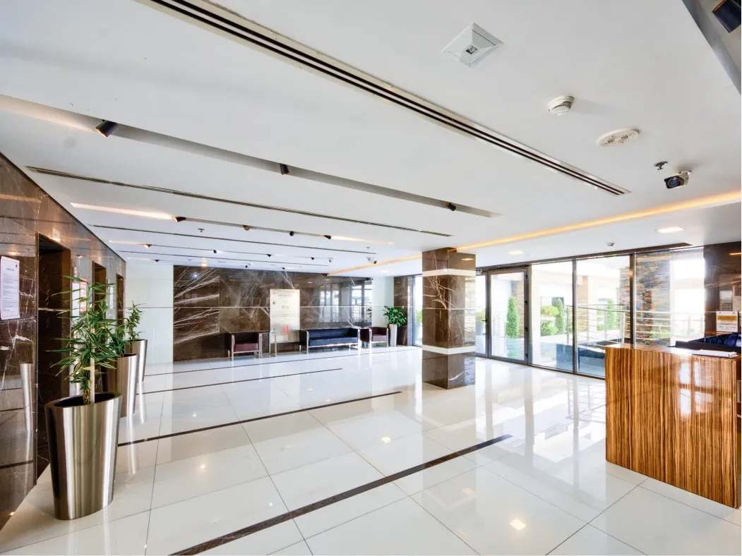 A modern hallway in Al Haseen Residence featuring a large wooden wall, showcasing contemporary design elements. 
