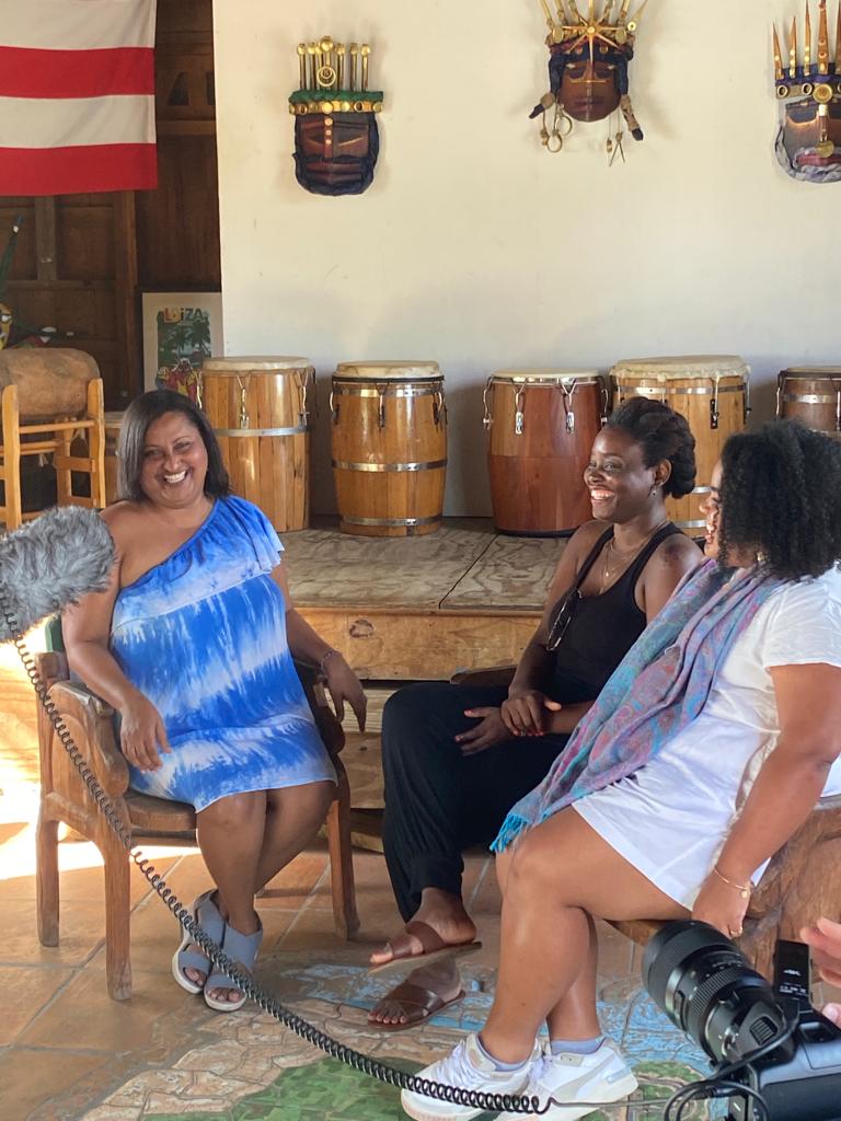 Three women laughing together during a documentary interview, Puerto Rico