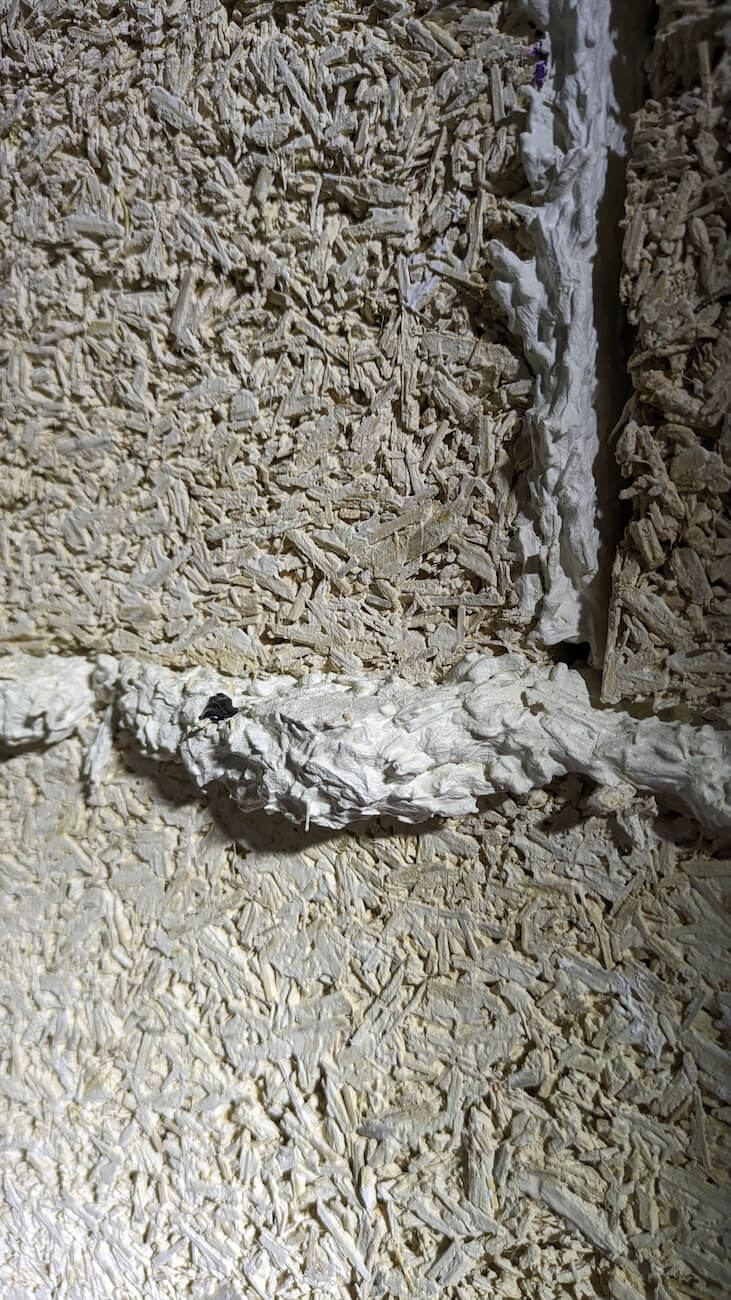 a beautiful hemp block wall showing the joints between the blocks filled with lime and hemp mortar for a natural, sustainable wall