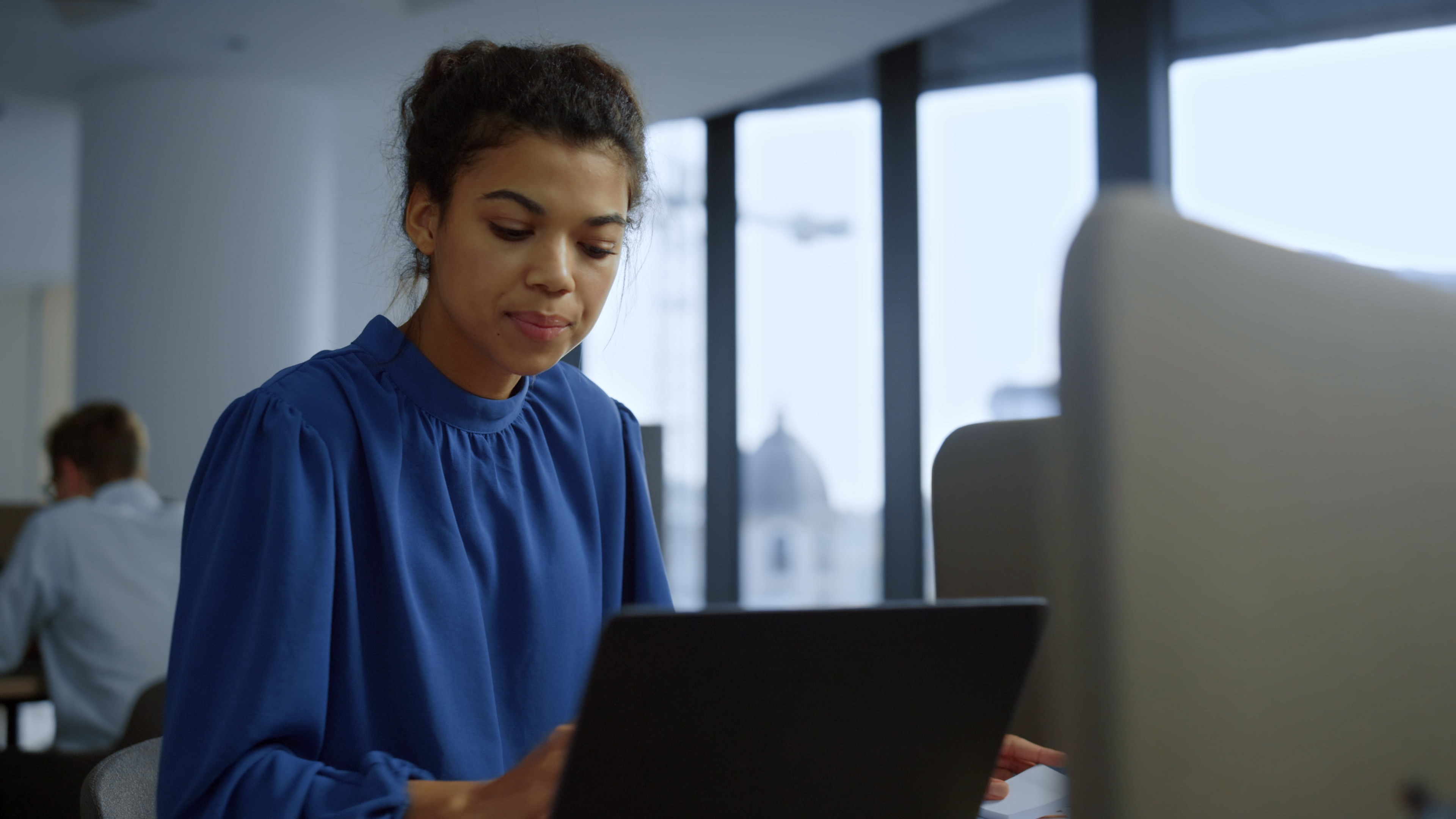 Colorful abstract artwork with overlapping green, blue, yellow, and red organic shapes.