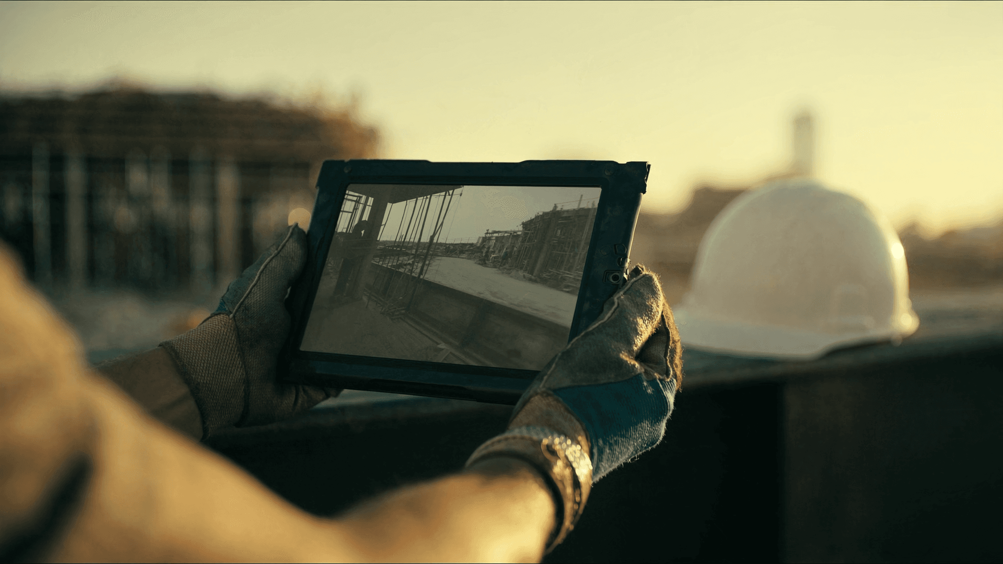 Supervisor reviewing time-lapse construction footage on a Chicago commercial build site