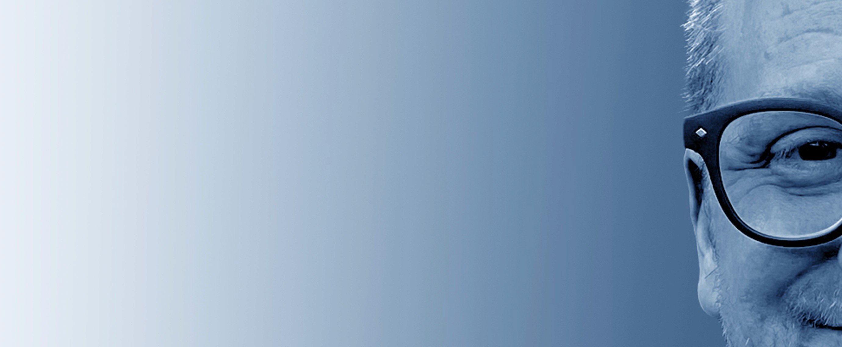Grayscale close-up portrait of Jeremy J. McLean, Senior UX, Visual, and Motion Designer, featured in hero banner with gradient blue background.