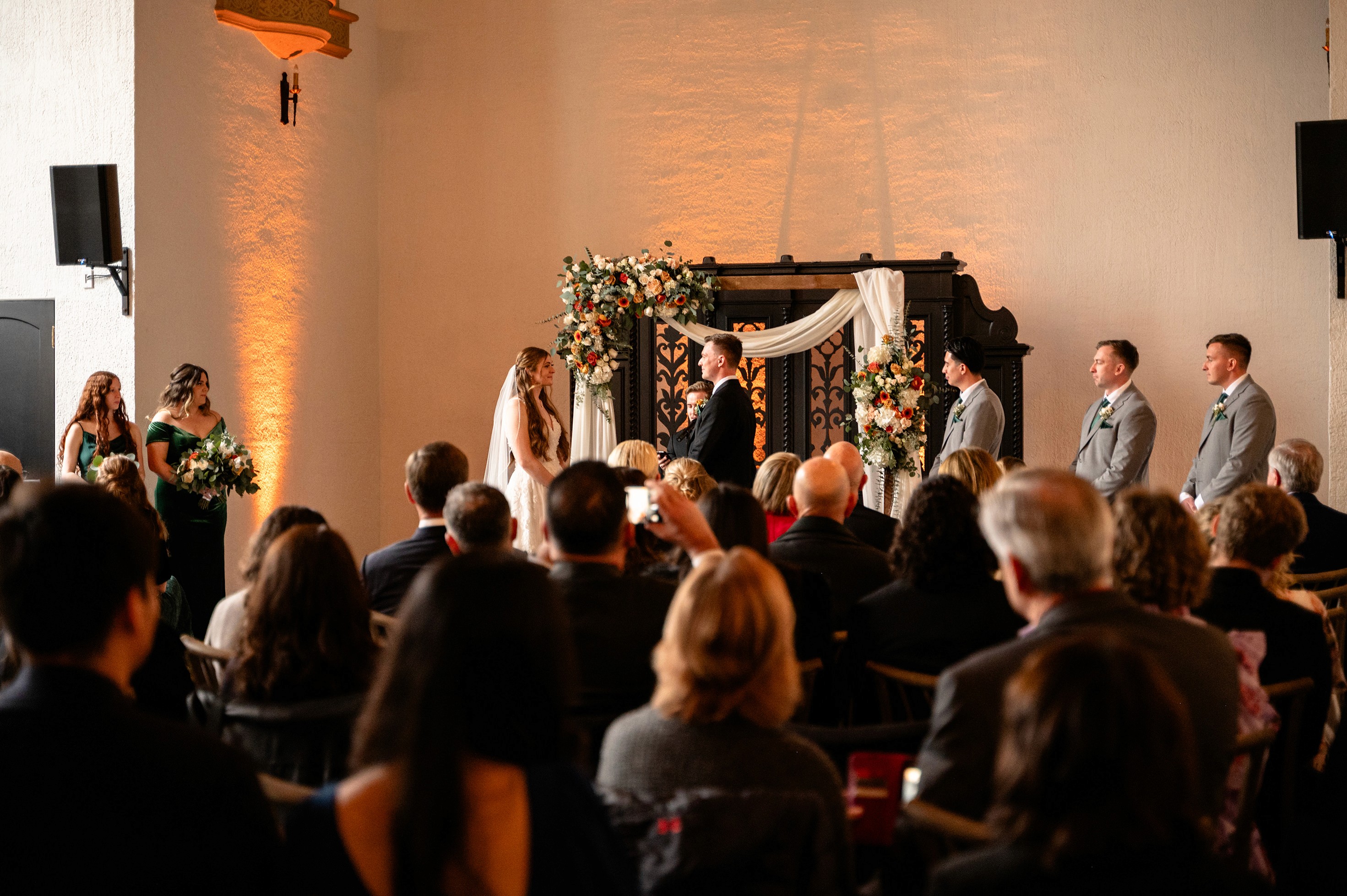 Flat lay wedding details with bouquet, rings, and sparkling bridal heels