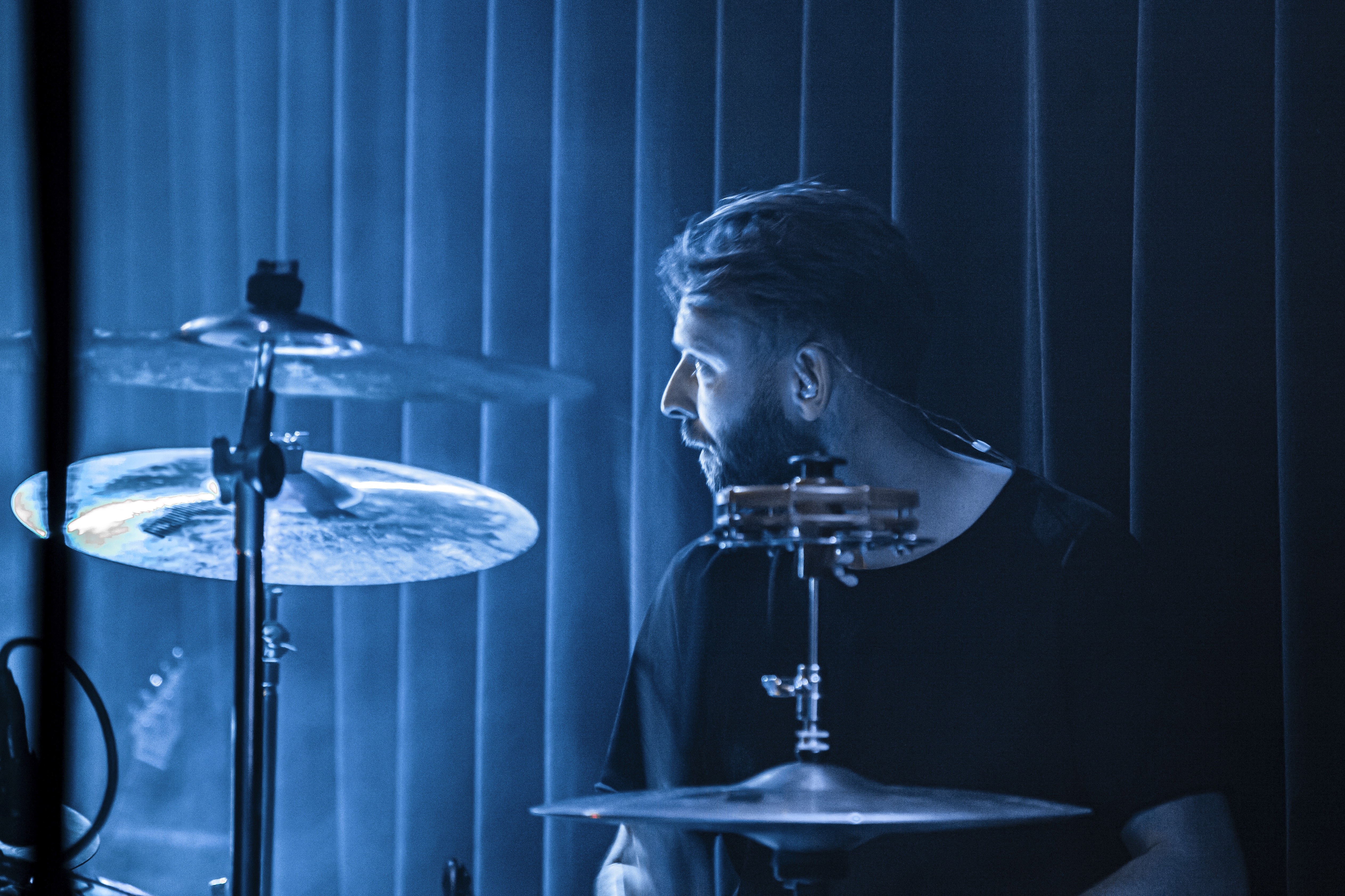 Guitarist performing on stage in silhouette