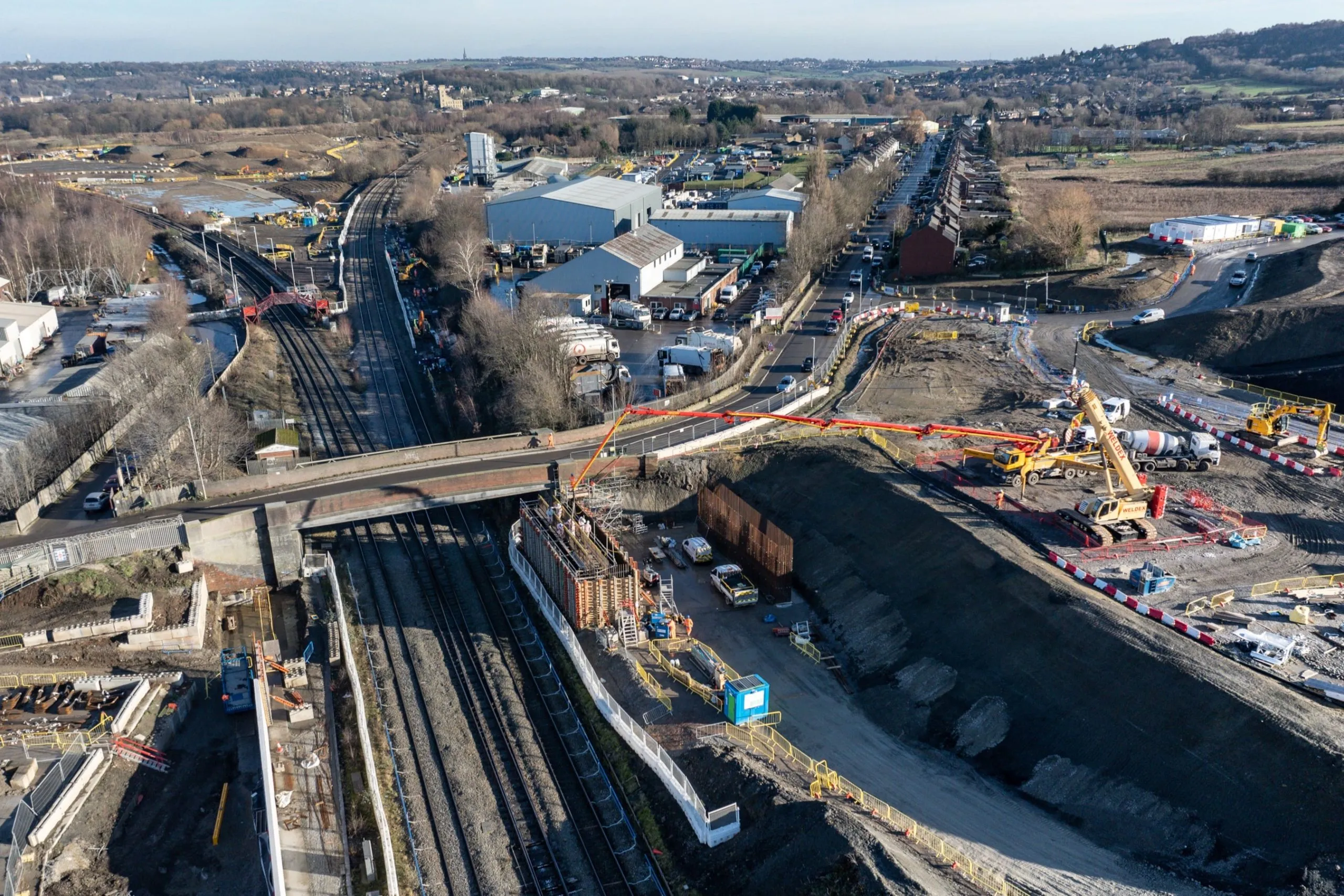Railway and construction works beside industrial buildings in Leeds.