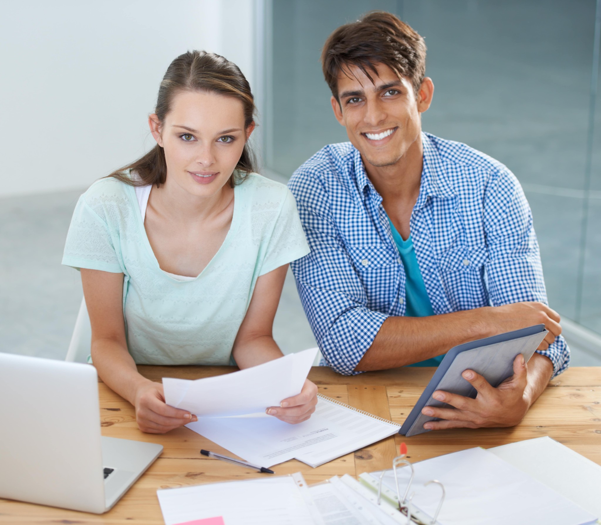 Two people showing pros of hard money loans.