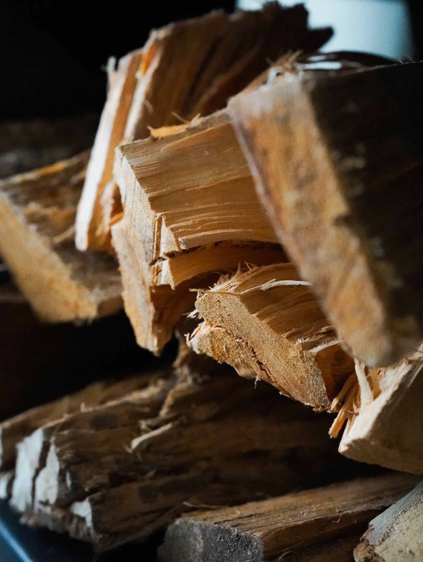 Stacked firewood detail at Villa Flora countryside retreat Portugal
