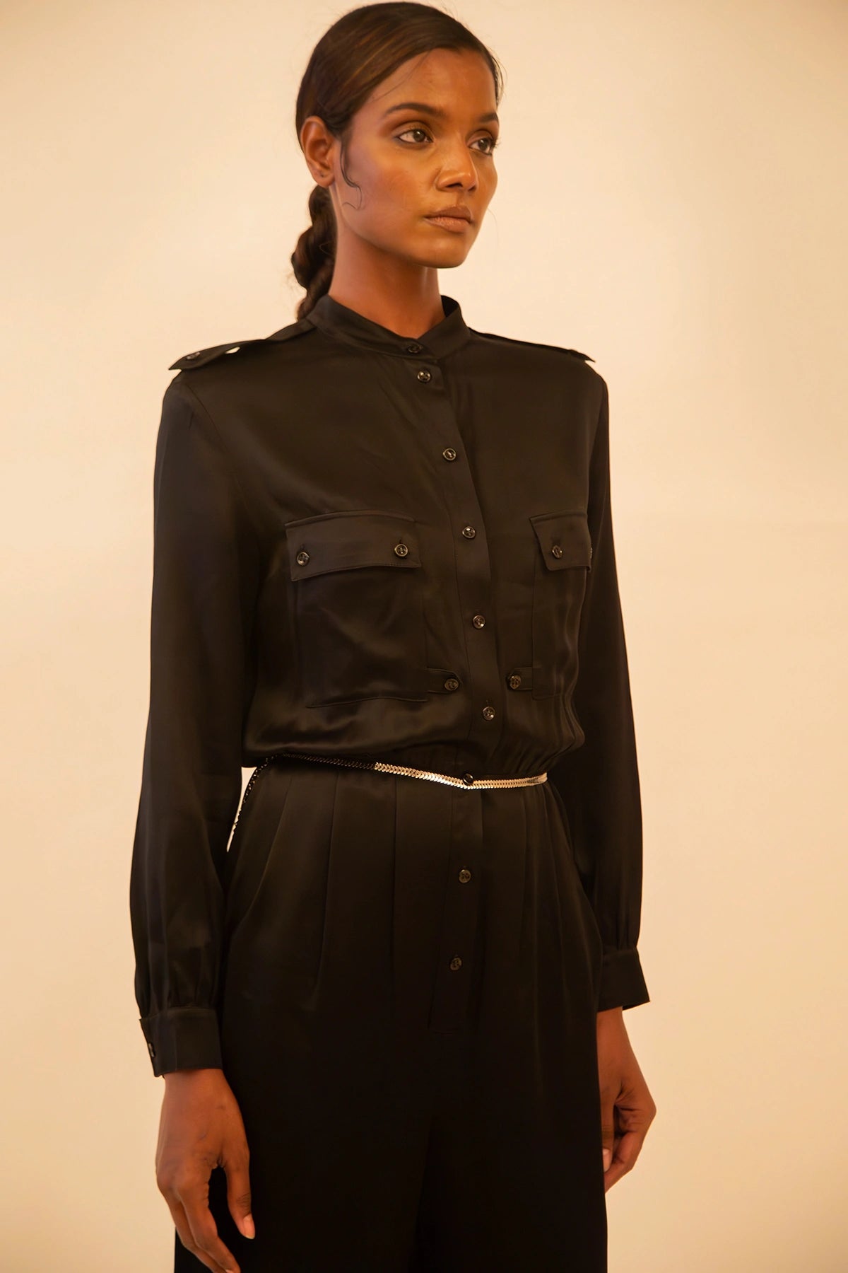 Vintage YSL black button-up jumpsuit featuring a tailored fit and classic detailing, sourced from global designer archives.