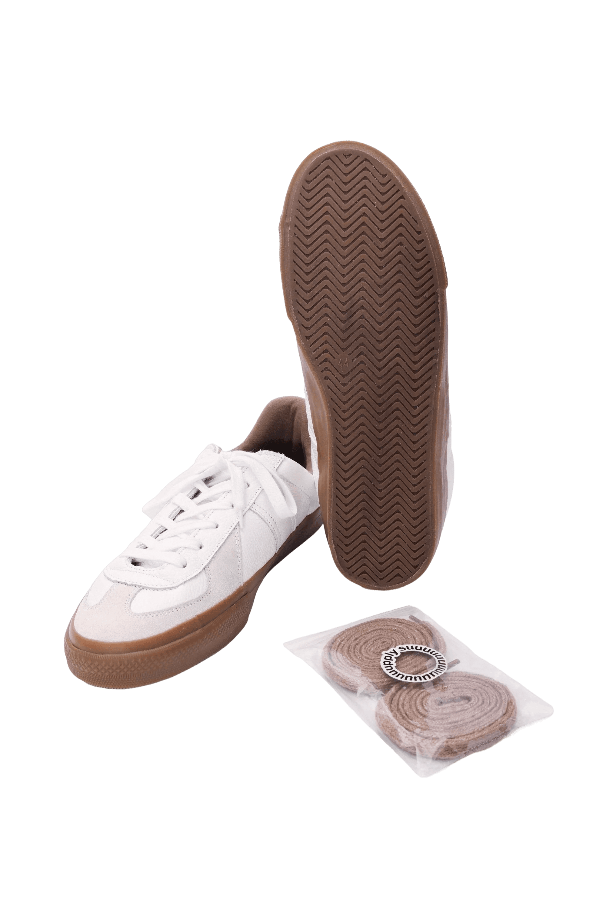 bottom view of a pair of white trainers