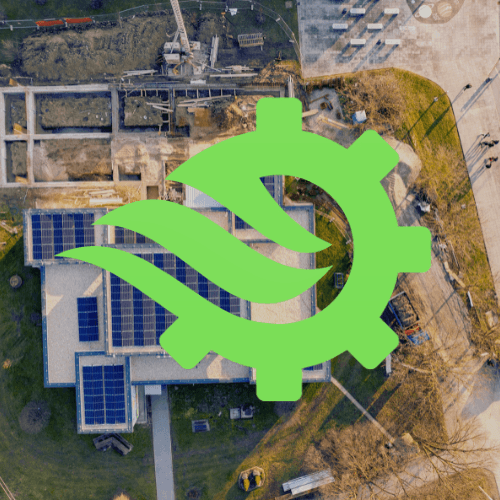 rows of solar panels in a field with mountains in the background