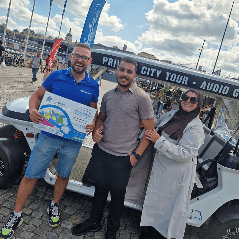 Tourists exploring Stockholm during private electric sightseeing cart tour