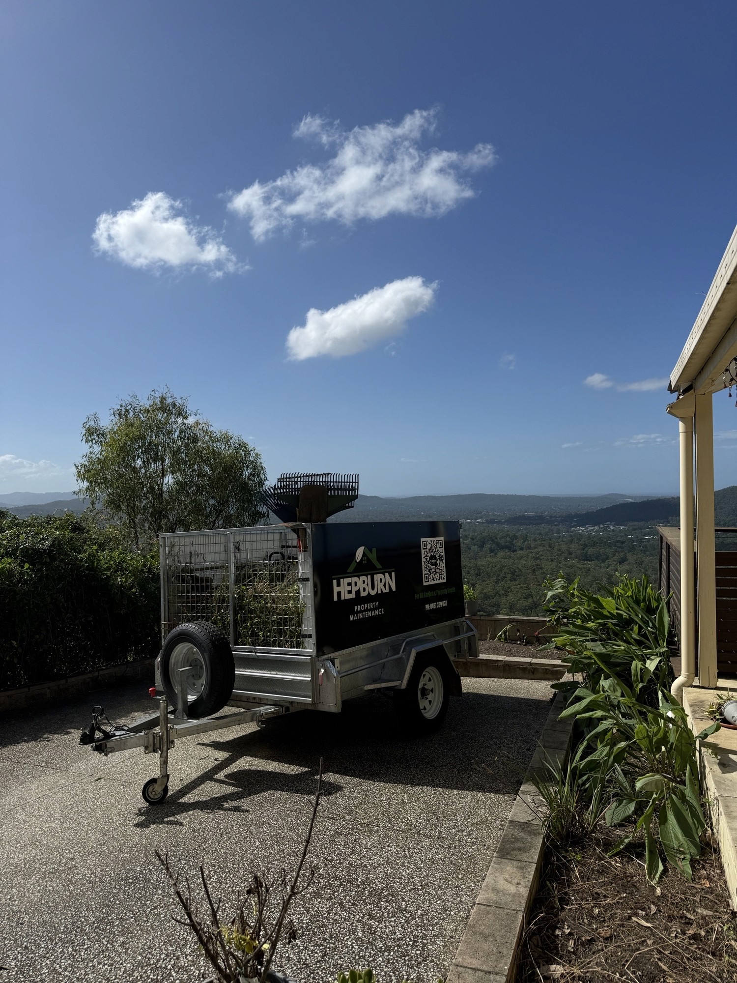 Hepburn Property Maintenance trailer on site overgrown garden clean up Tallai Gold Coast
