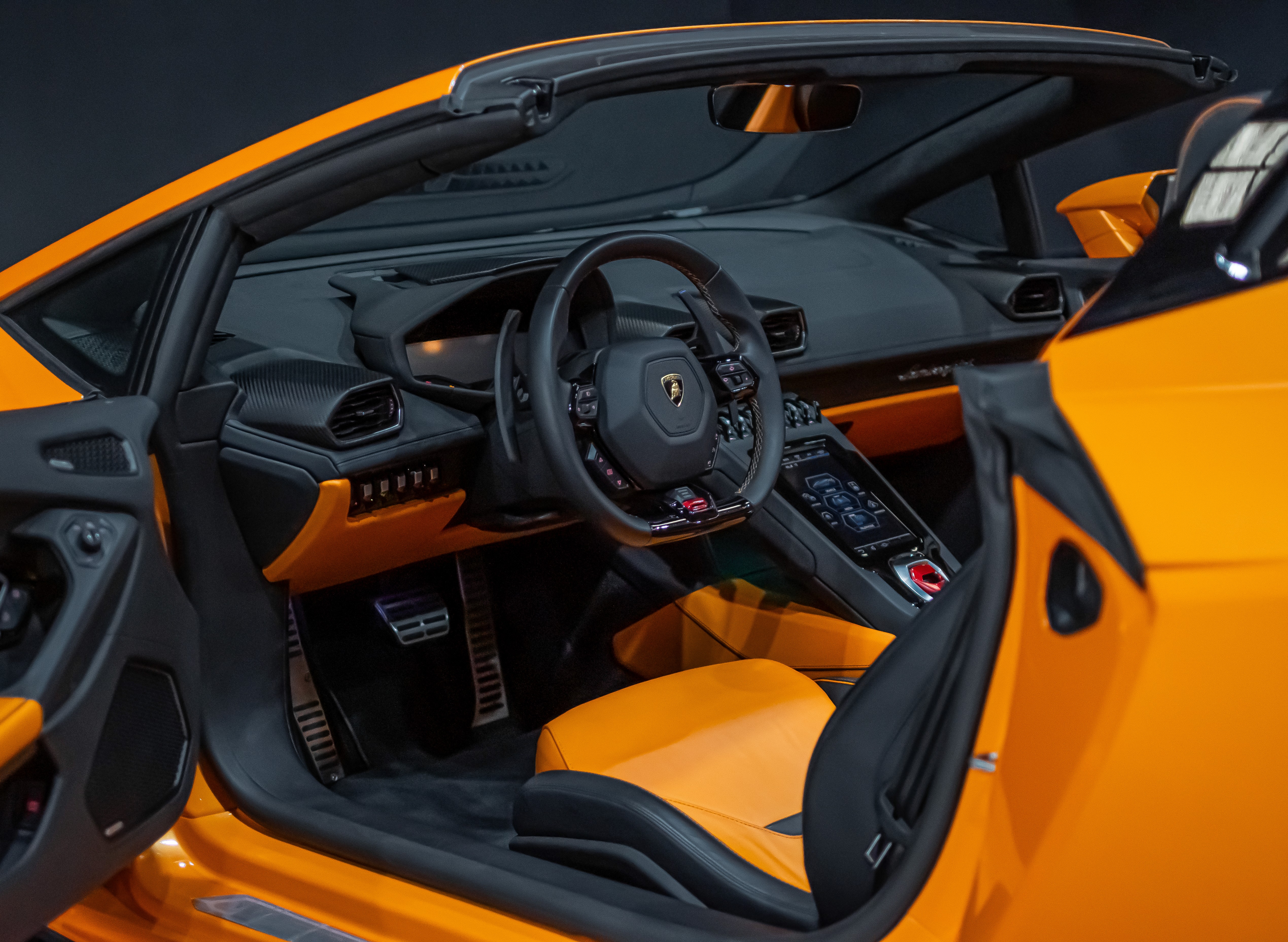 Interior cockpit of Lamborghini Huracan EVO Spyder luxury rental car in Dubai