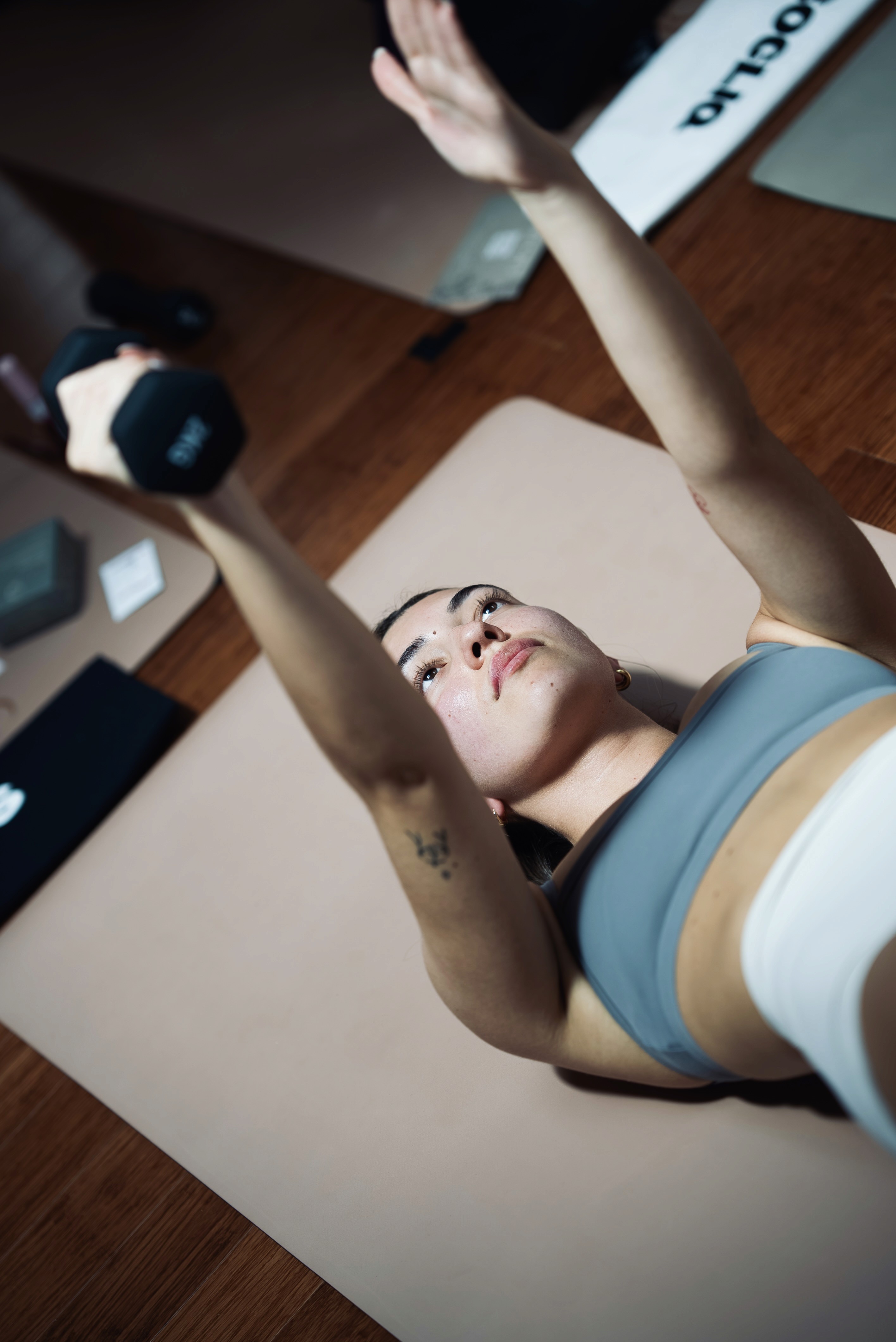 Two women doing a challenging a mat flow class with intention, in Toronto