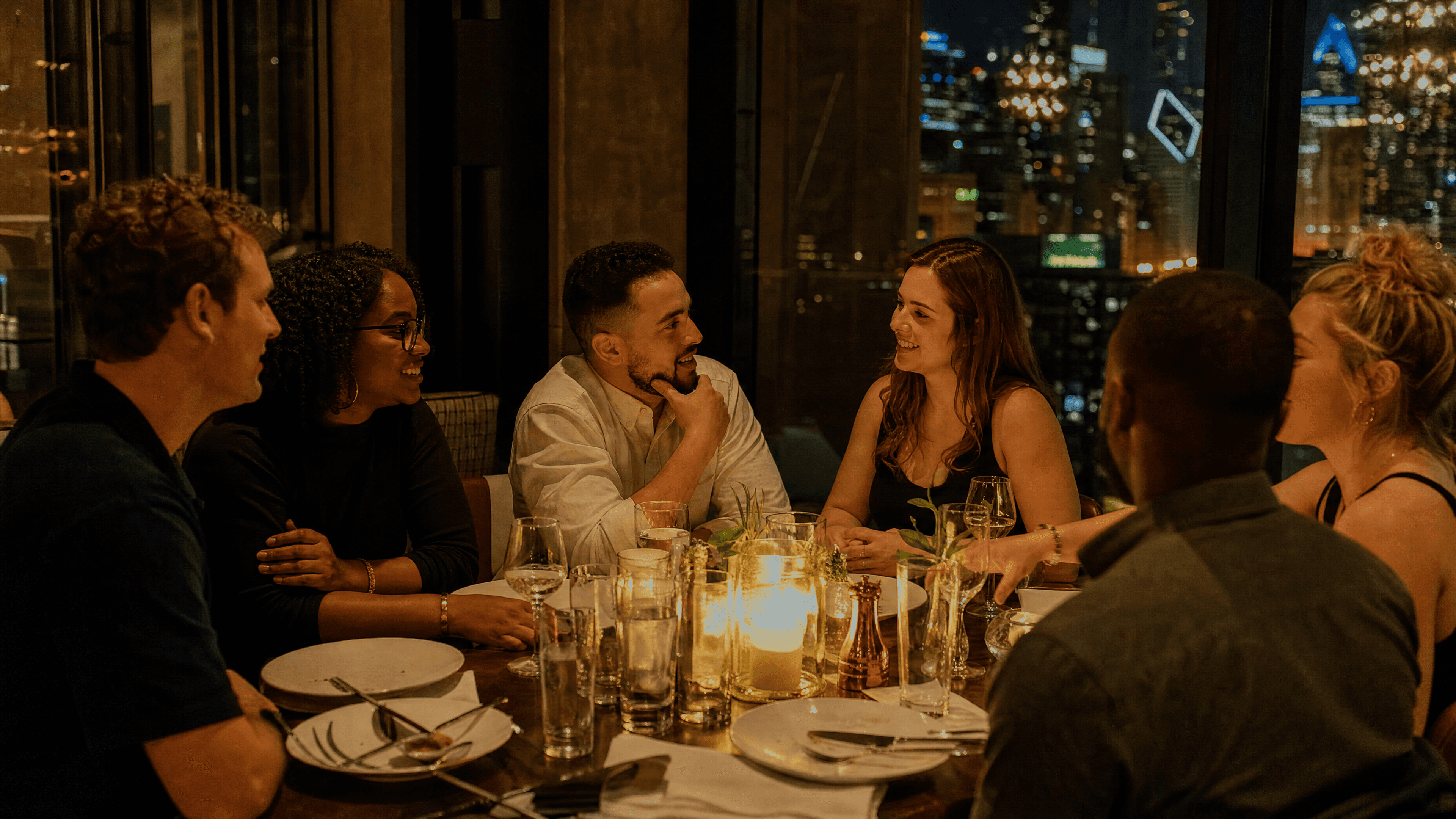 An elegant candlelit dinner table set for a meaningful evening