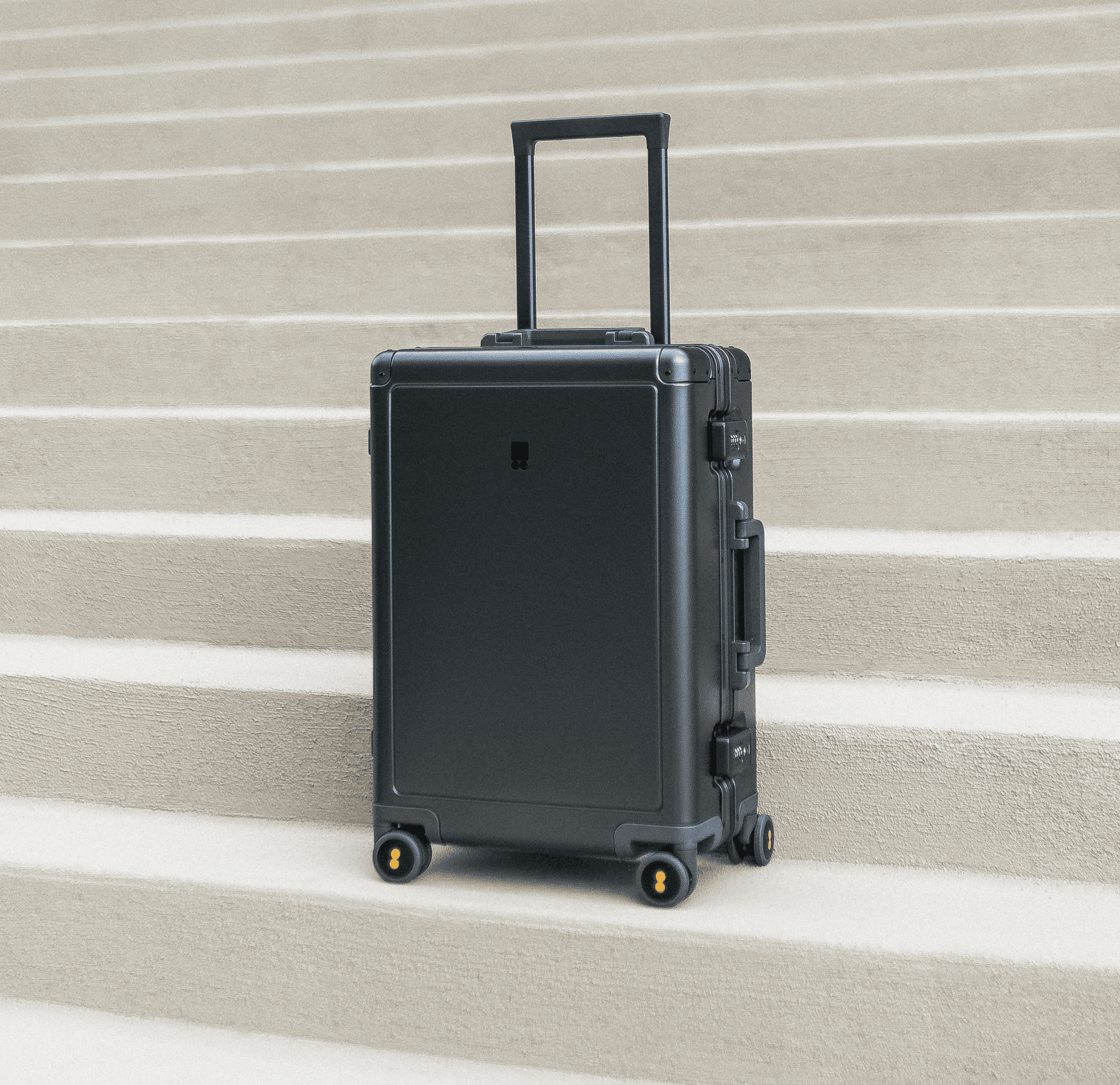 a black suitcase on a staircase