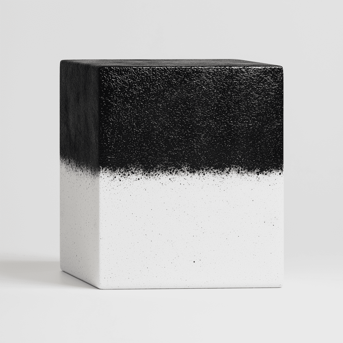 A black and white cube featuring a distinct white border.