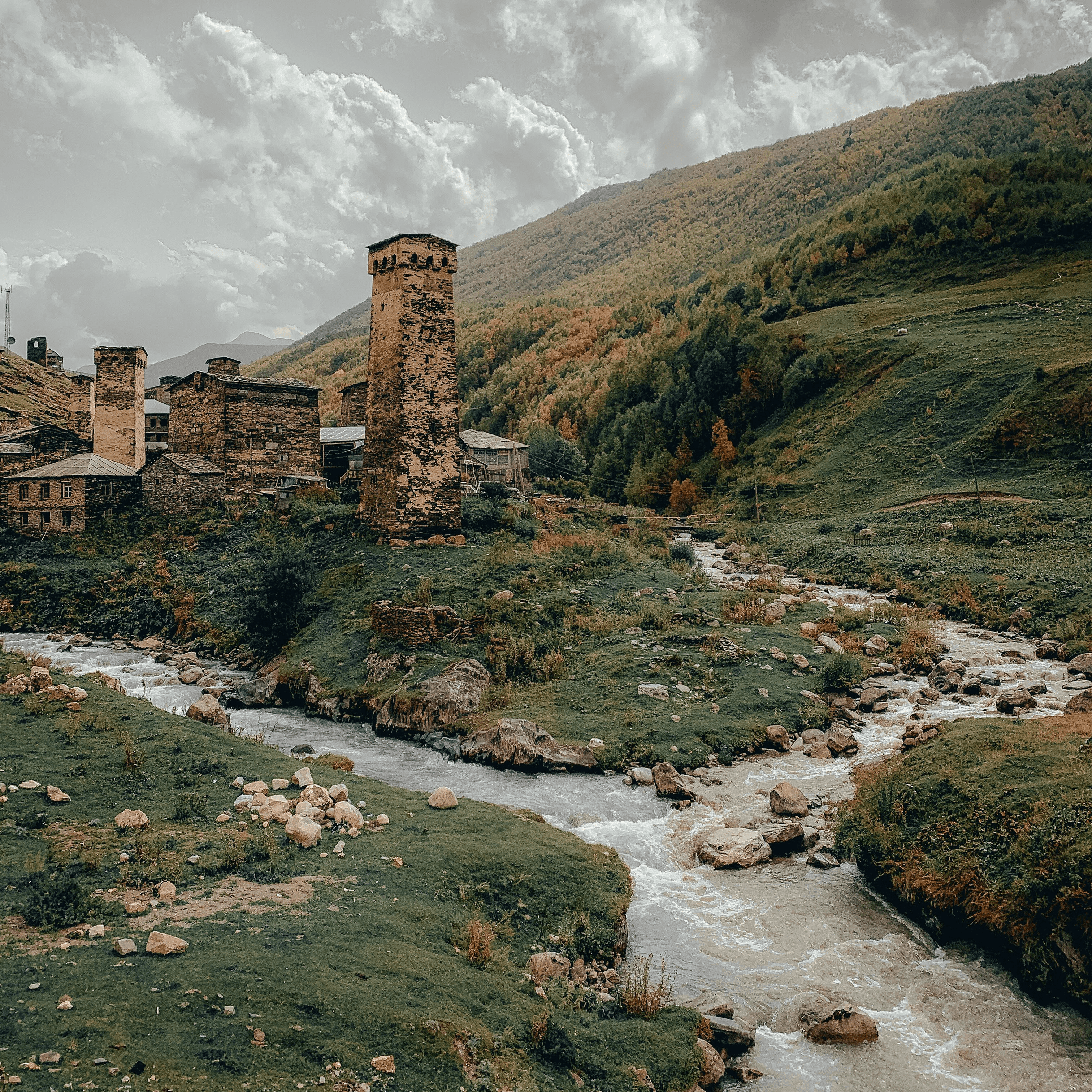 Svan stone towers and a mountain river, Ushguli, Georgia