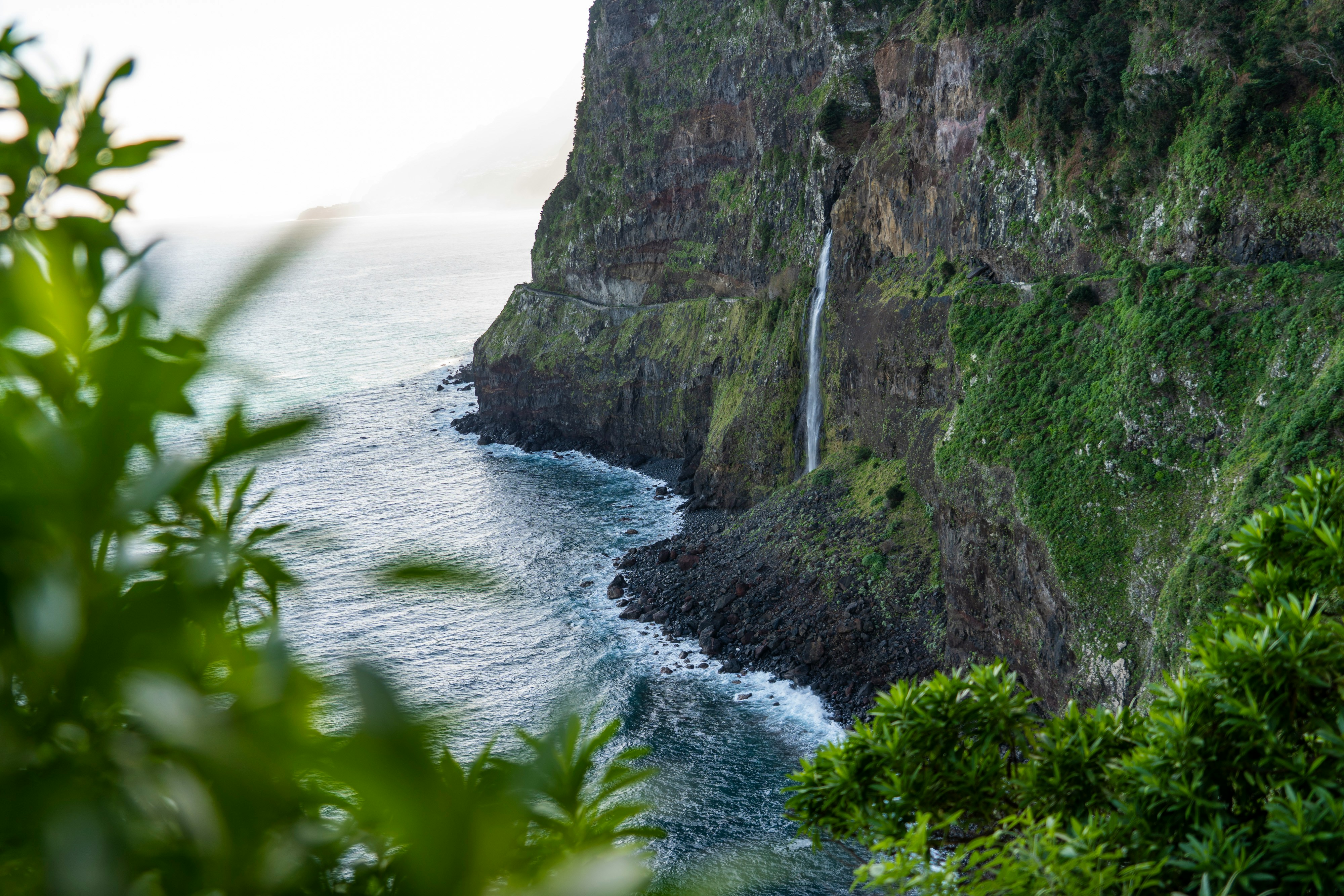 A view of a waterfall in the middle of the ocean