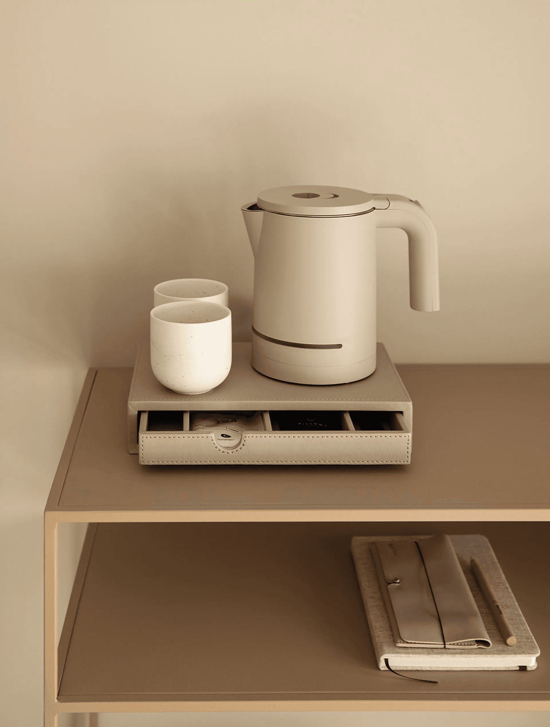 orange kettle on brown wooden table