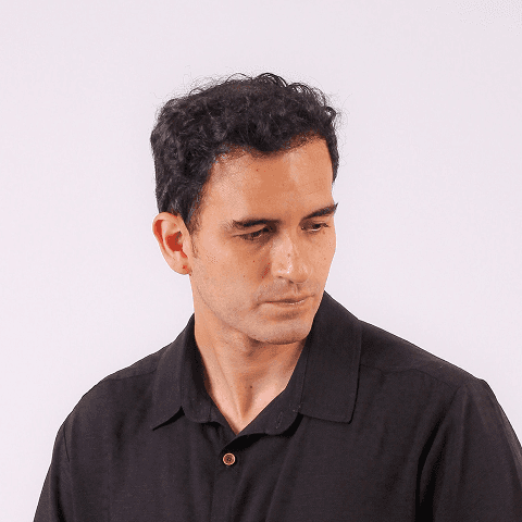 Man in black shirt looking down
