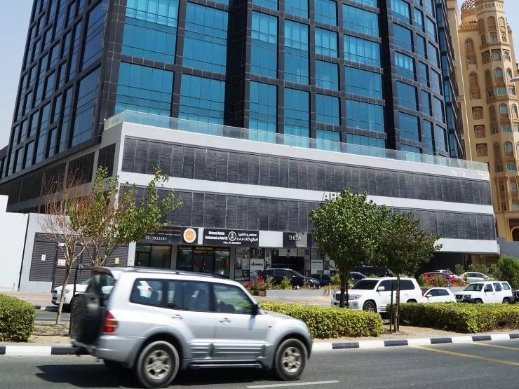 Full symmetrical view of the impressive Apricot Tower facade, a premium choice for corporate headquarters.