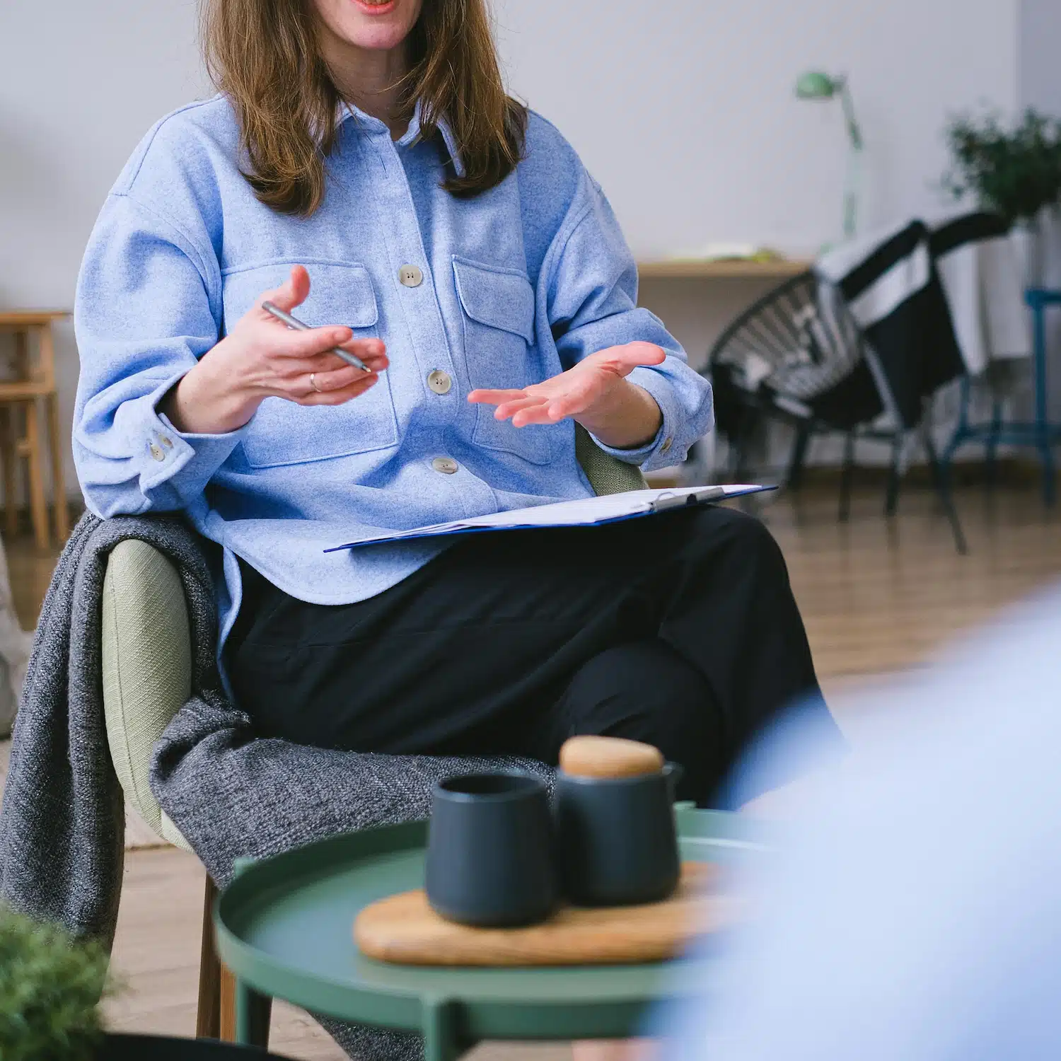 Therapist talking with a client during a gender exploration therapy session in Los Angeles, offering affirming and supportive care for identity and transition.