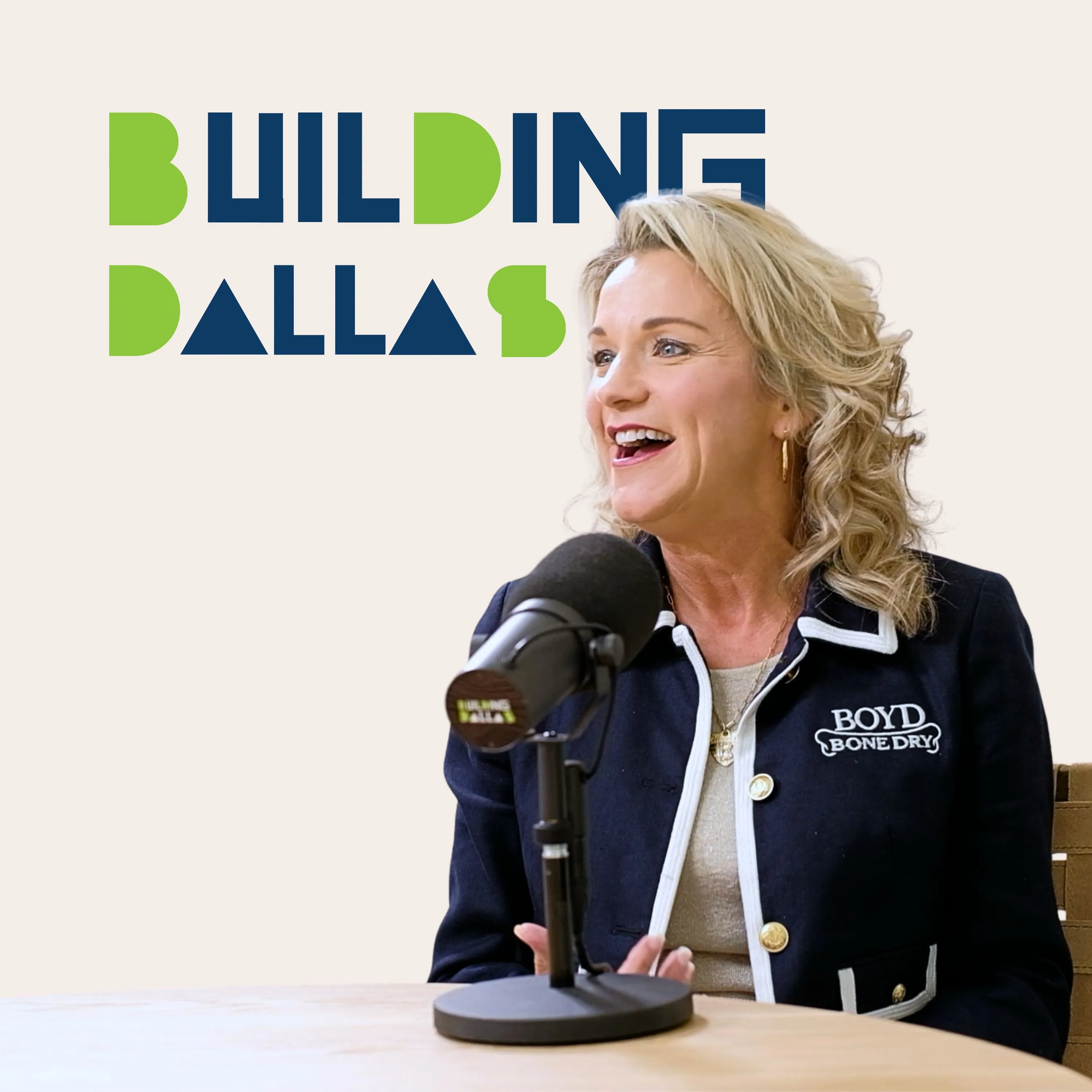 guest speaking into microphones with “Building Dallas” branding