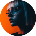 Portrait of a person with short hair and large glasses, set against a vibrant orange and blue background. The mood is edgy and modern.