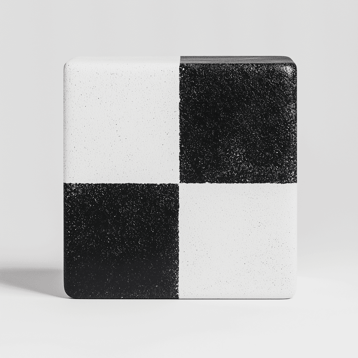 A black and white square block featuring a geometric square pattern.