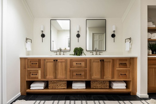 Nordic Bathroom in a beautiful remodeled bathroom in redomond, WA.  Oak colored cabinets with dual mirrors and dual sink