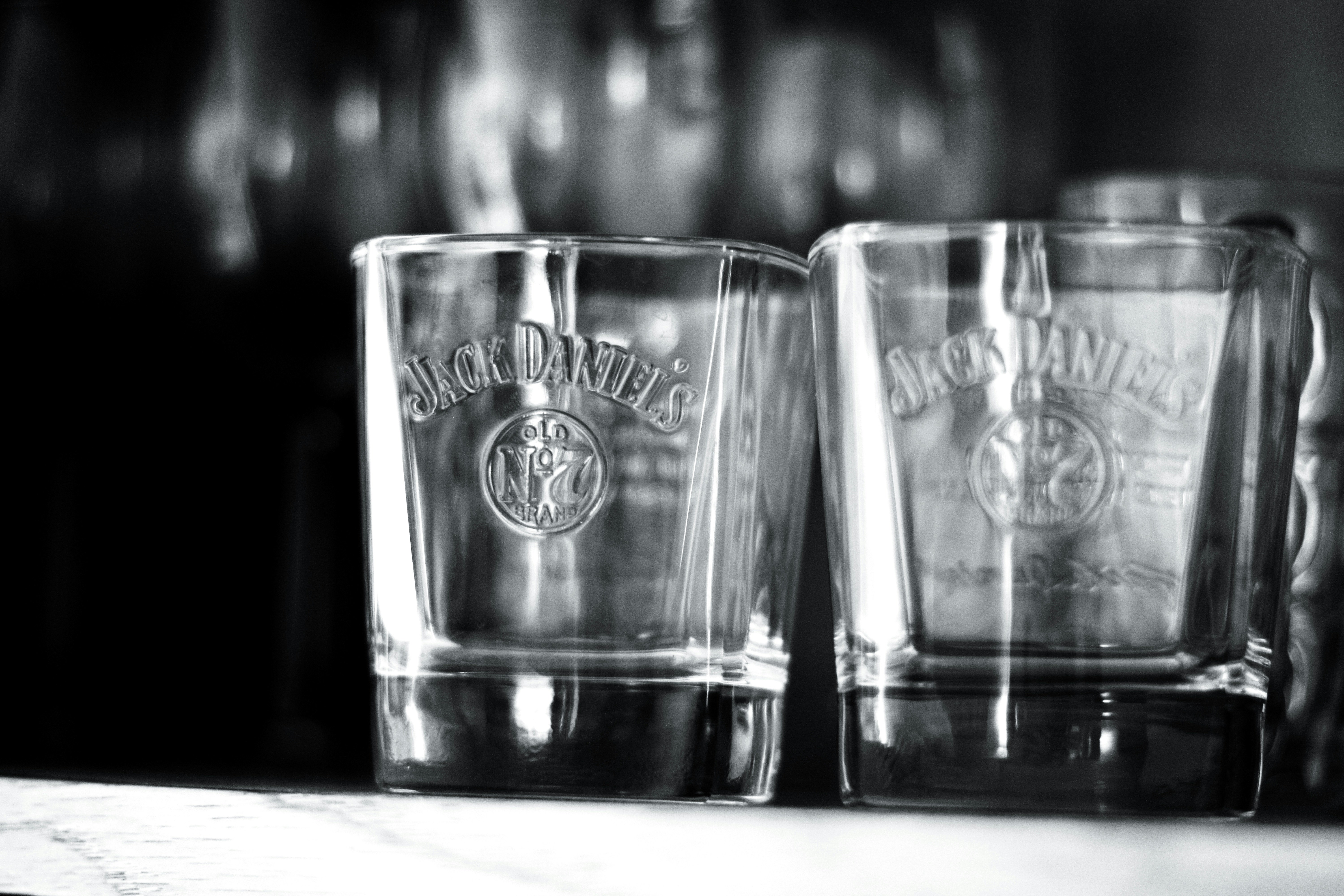 Three shot glasses sitting on top of a counter