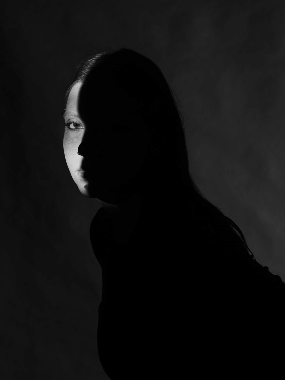 Portrait of a young woman in black and white