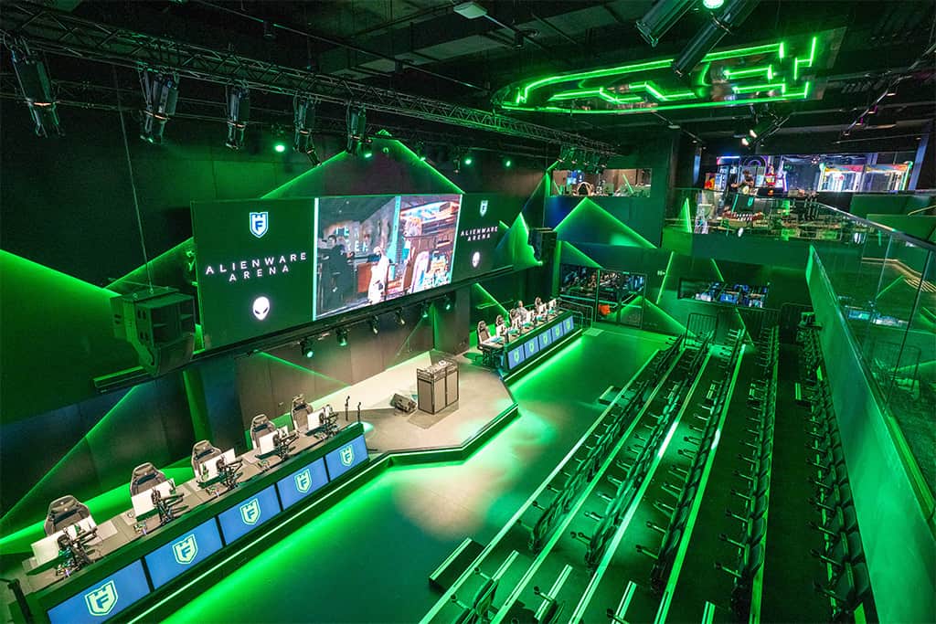 A conference with people playing pac man at Fortress