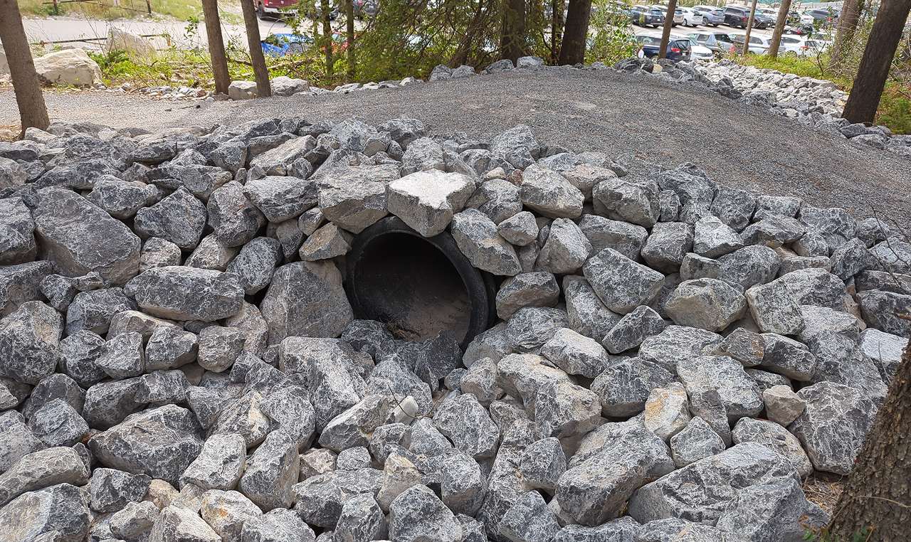 Culvert outlet with riprap erosion protection for trail drainage system at Grassi Lakes