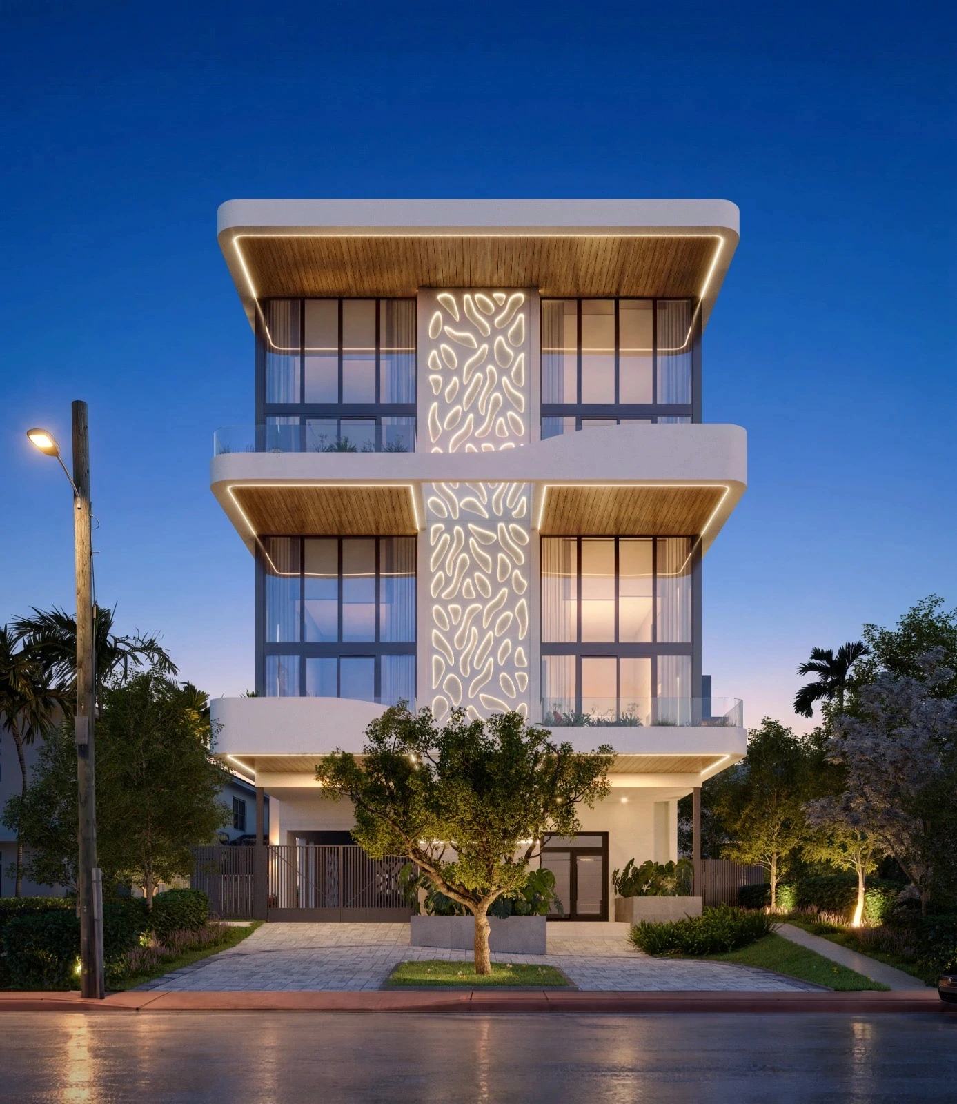 Byron Avenue Residence in North Beach, Miami Beach at dusk, with backlit perforated facade screen, cantilevered balconies and wood soffits