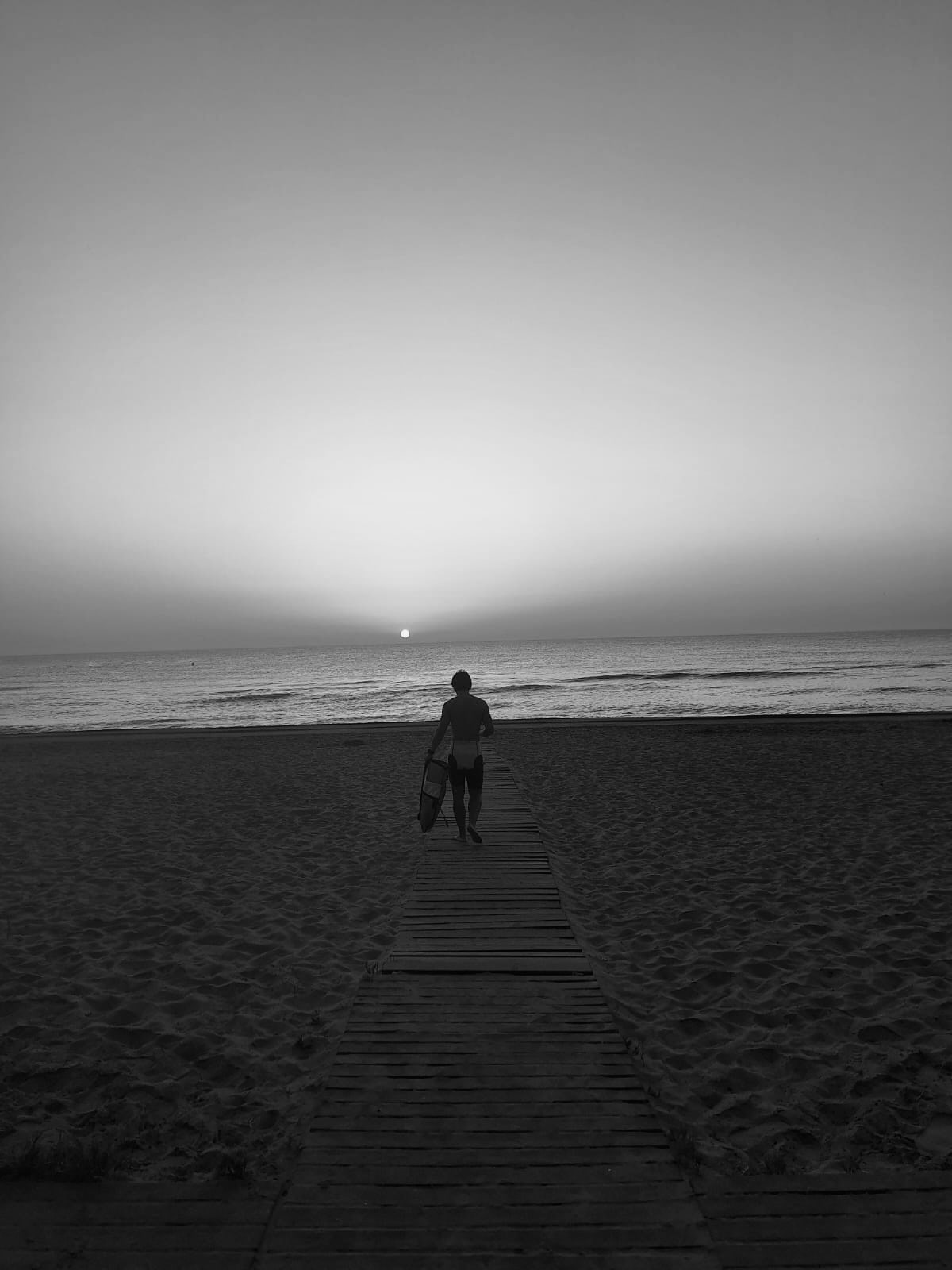 Carlos Rodilla on the beach with a sunset