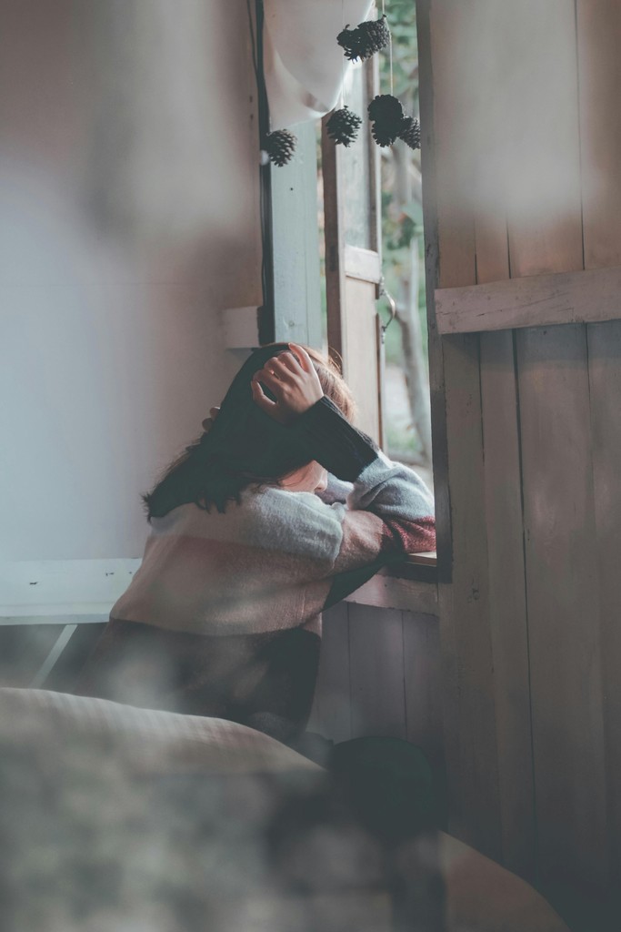 A person looking out the window.