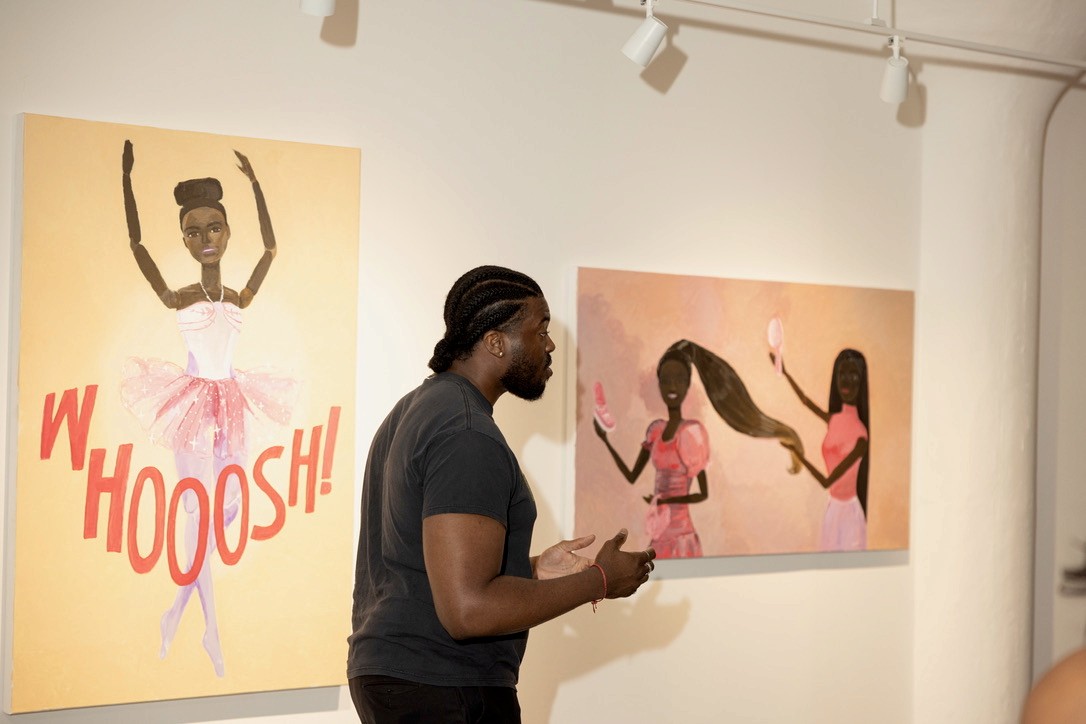 Discussion beside installed paintings