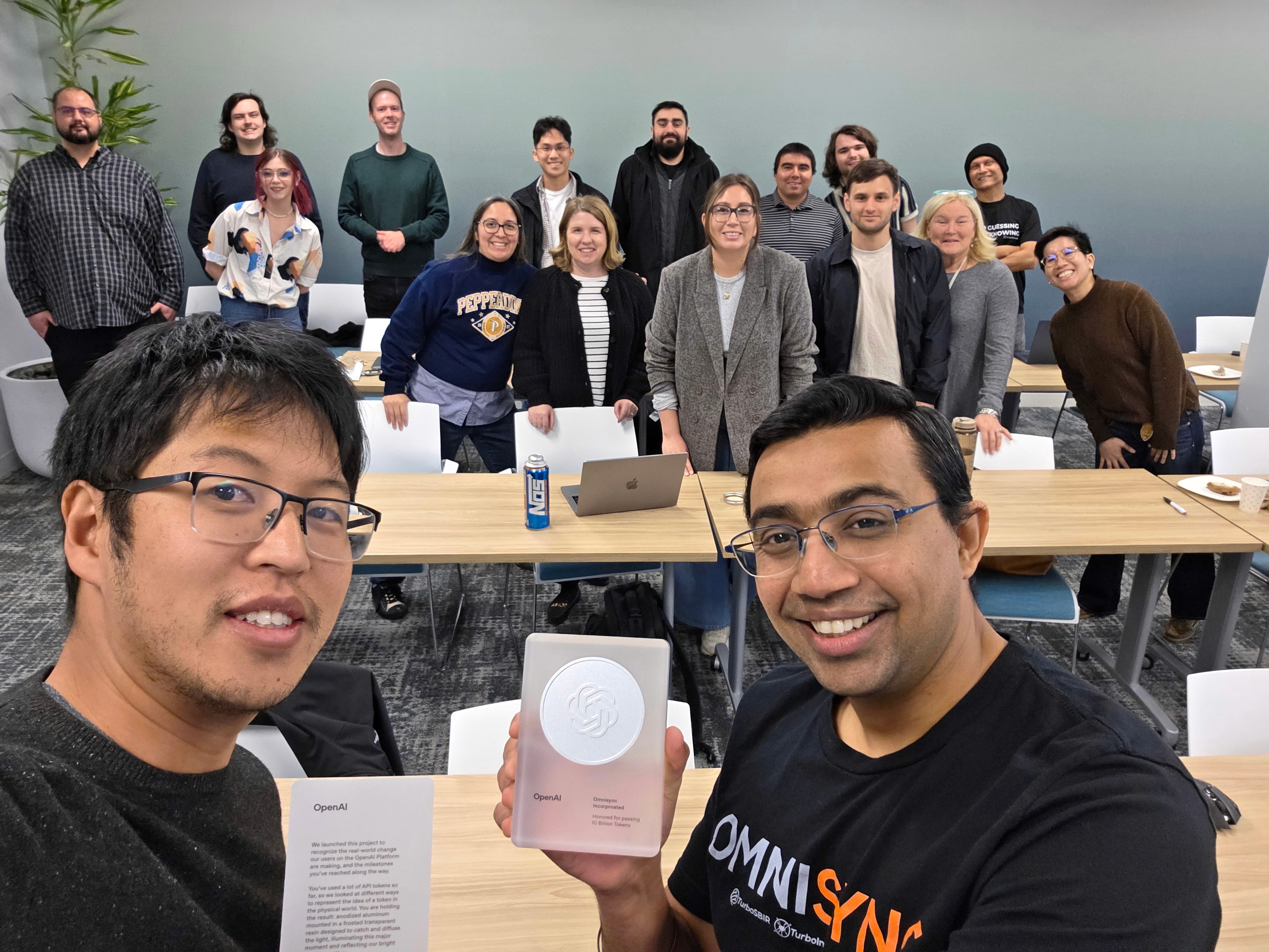OmniSync team photo with trophy from Open AI