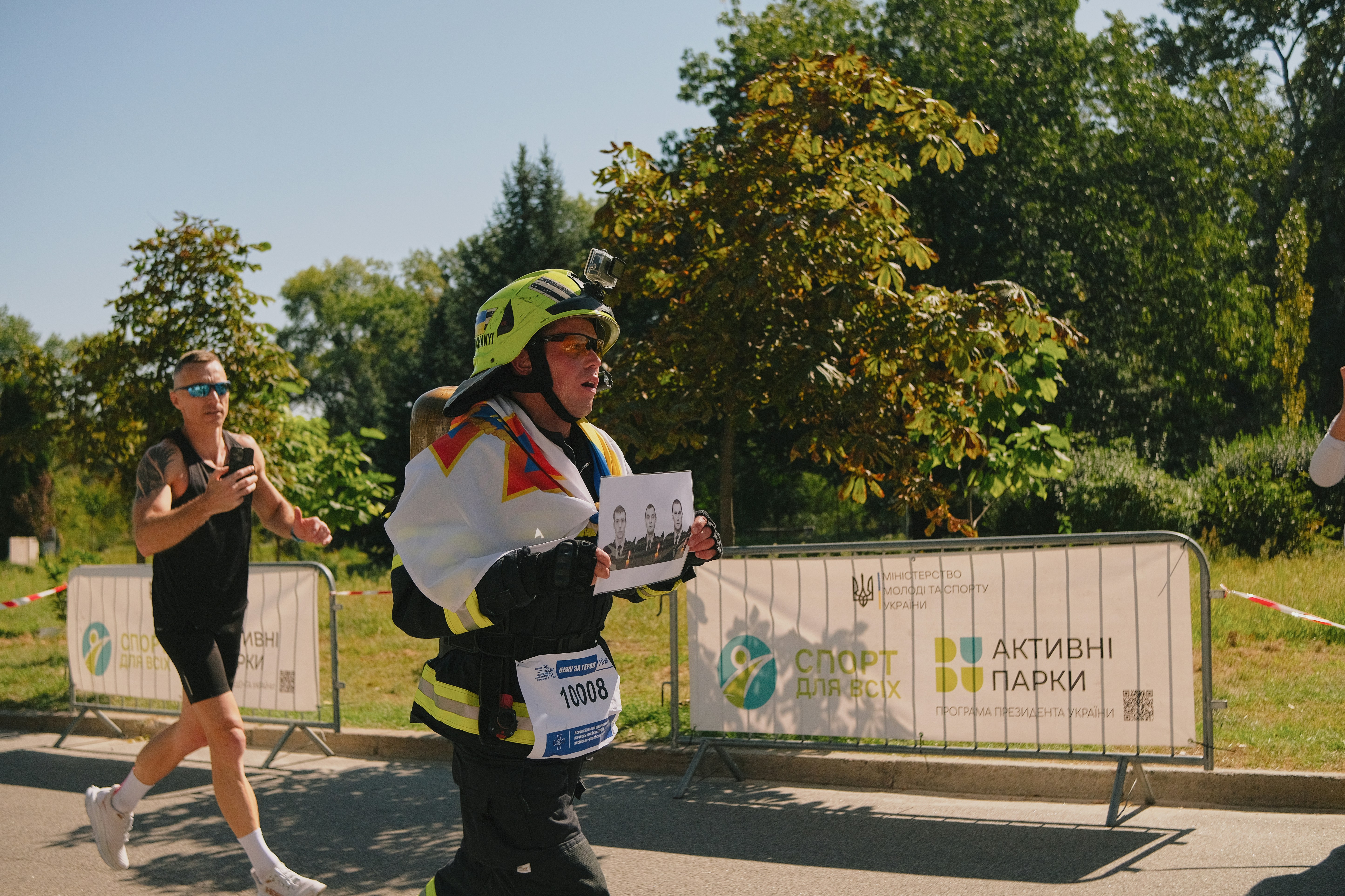 Runner passes official at outdoor event