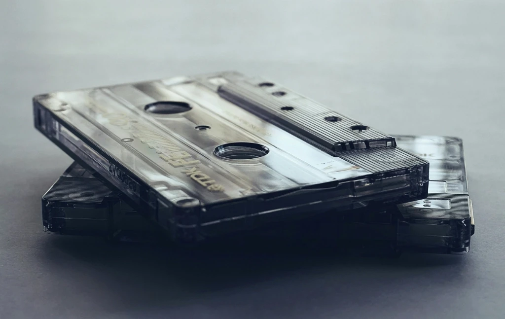 Two old cassette tapes stacked on each other.